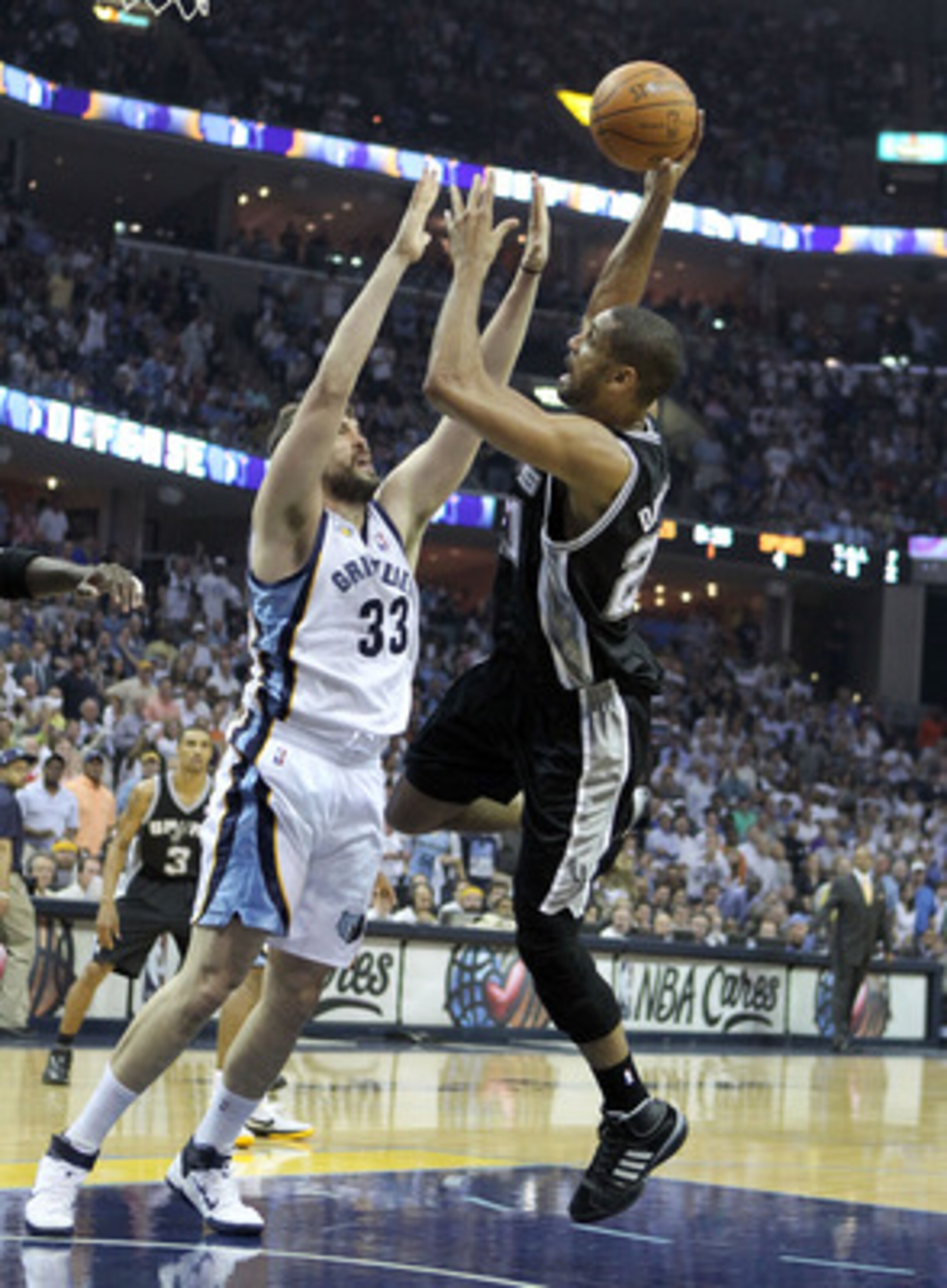 MEMPHIS, TN - APRIL 29:  Tim Duncan #21 of the San Antonio Spurs shoots the ball while defended by Marc Gasol #33 of the Memphis Grizzlies in Game Six of the Western Conference Quarterfinals in the 2011 NBA Playoffs at FedExForum on April 29, 2011 in Memp