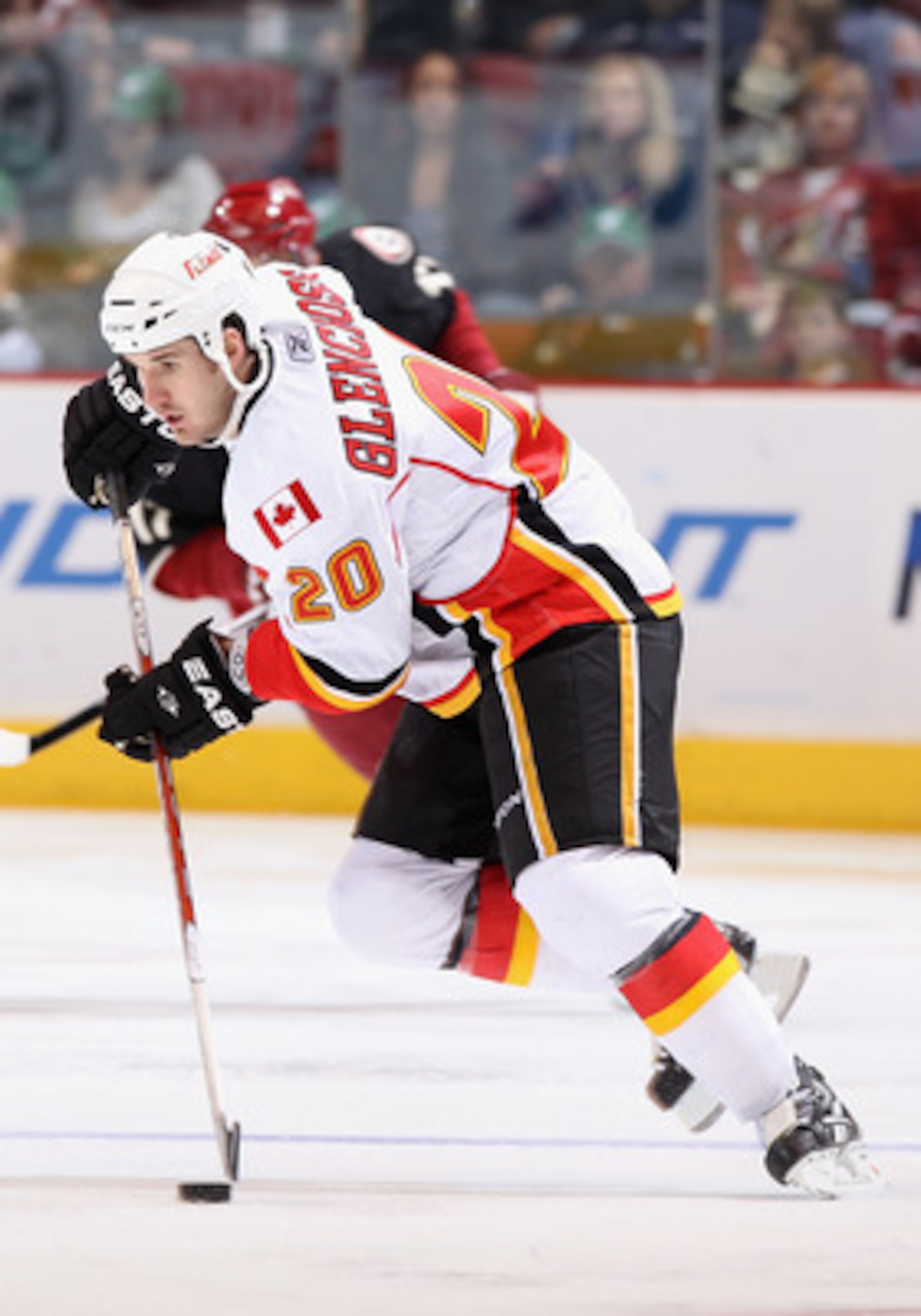 GLENDALE, AZ - MARCH 10:  Curtis Glencross #20 of the Calgary Flames skates with the puck during the NHL game against the Phoenix Coyotes at Jobing.com Arena on March 10, 2011 in Glendale, Arizona.  The Coyotes defeated the Flames 3-0.  (Photo by Christia