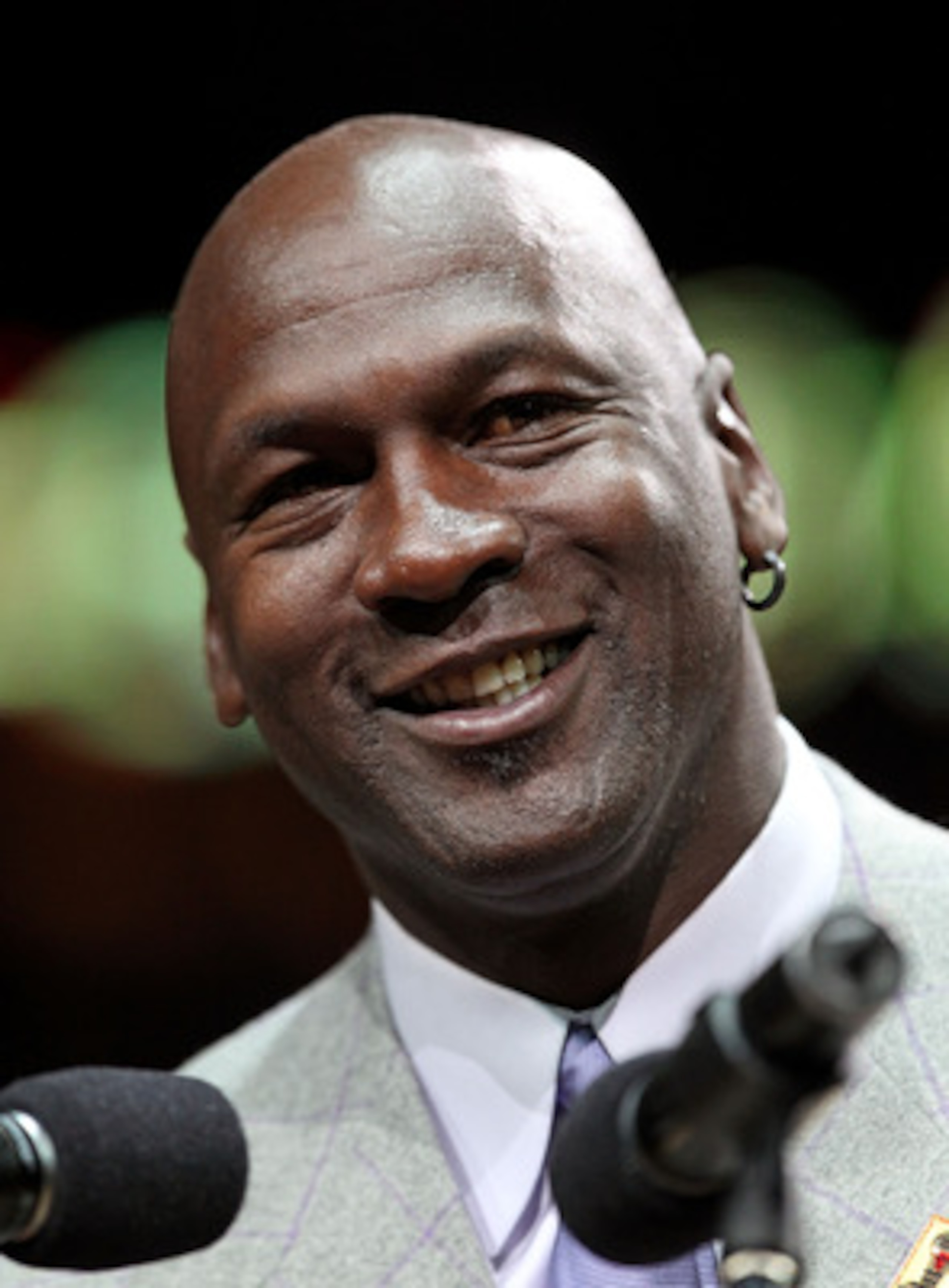 CHICAGO, IL - MARCH 12: Former player Michael Jordan of the Chicago Bulls addresses the crowd during a 20th anniversary recognition ceremony of the Bulls 1st NBA Championship in 1991 during half-time of a game bewteen the Bulls and the Utah Jazz at the Un