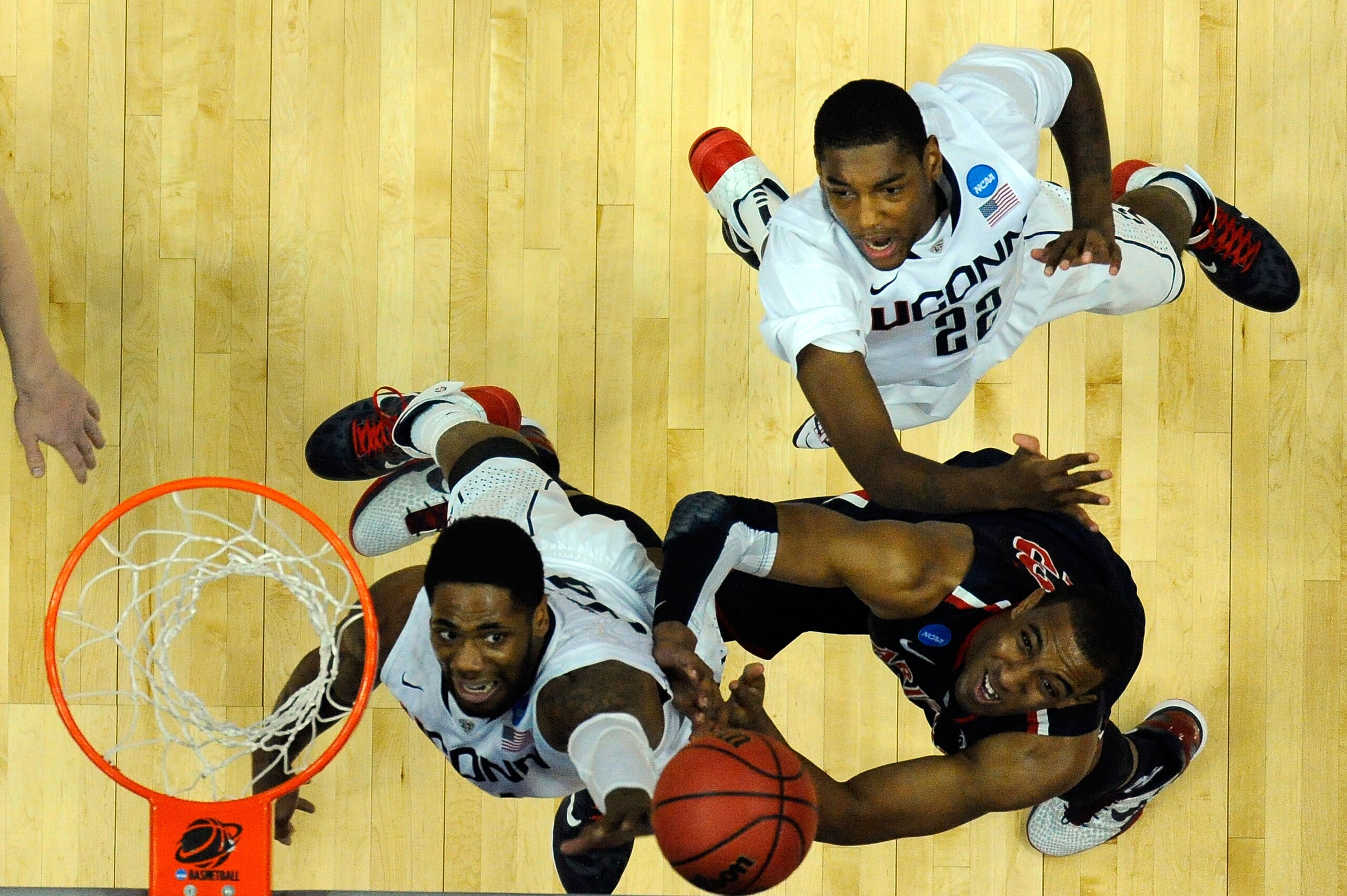 ANAHEIM, CA - MARCH 26:  Alex Oriakhi #34 and Roscoe Smith #22 of the Connecticut Huskies fight for a rebound against Derrick Williams #23 of the Arizona Wildcats during the west regional final of the 2011 NCAA men's basketball tournament at the Honda Cen