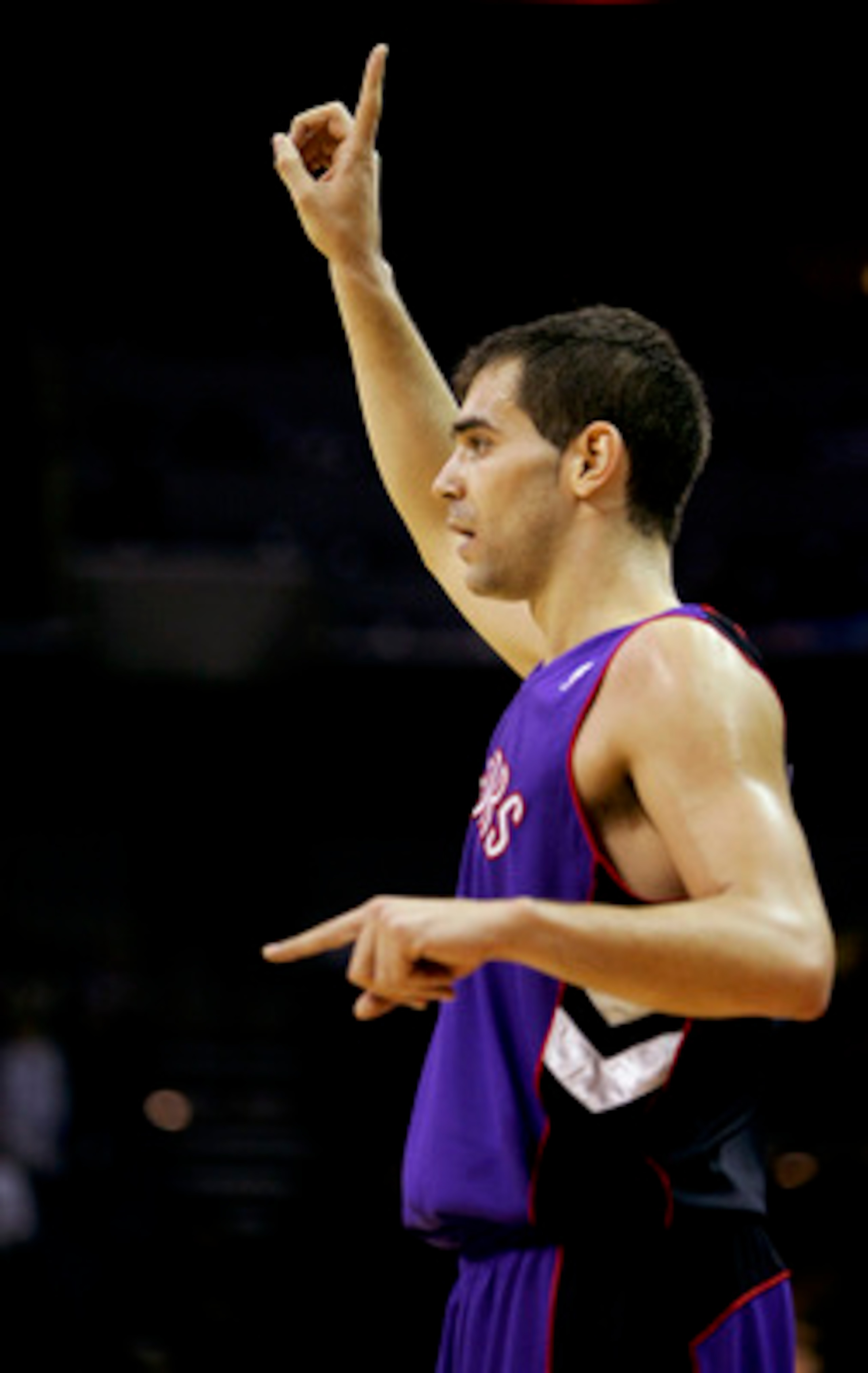 CHARLOTTE, NC - DECEMBER 10:  Jose Calderon #8 of the Toronto Raptors calls a play against the Charlotte Bobcats during their game on December 10, 2005 at the Charlotte Bobcats Arena in Charlotte, North Carolina. The Raptors defeated the Bobcats 111-103. 
