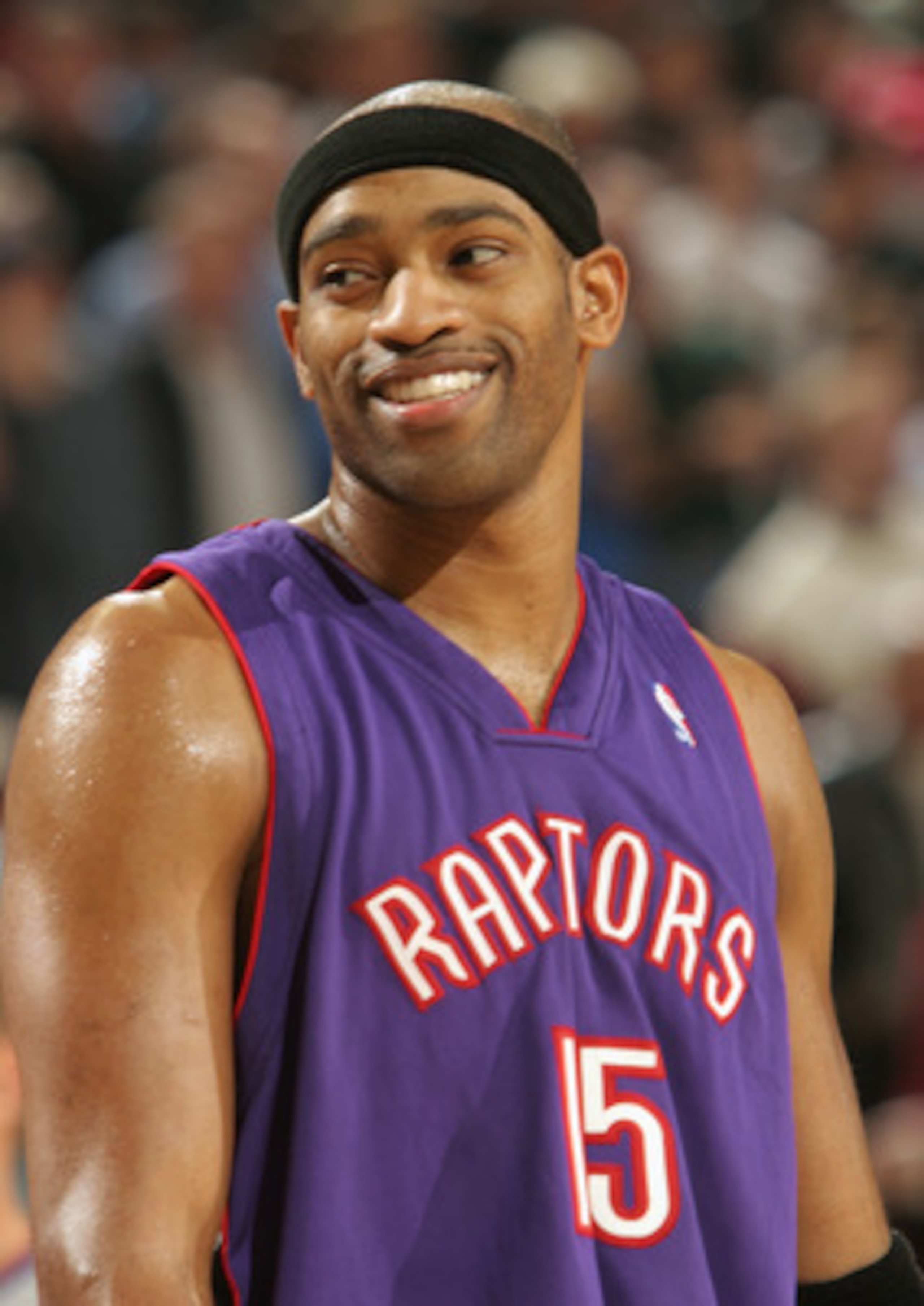SEATTLE - NOVEMBER 12:  Vince Carter #15 of the Toronto Raptors smiles during the game against the Seattle Sonics on November 12, 2004 at Key Arena in Seattle, Washington. The Sonics won 88-87. NOTE TO USER: User expressly acknowledges and agrees that, by