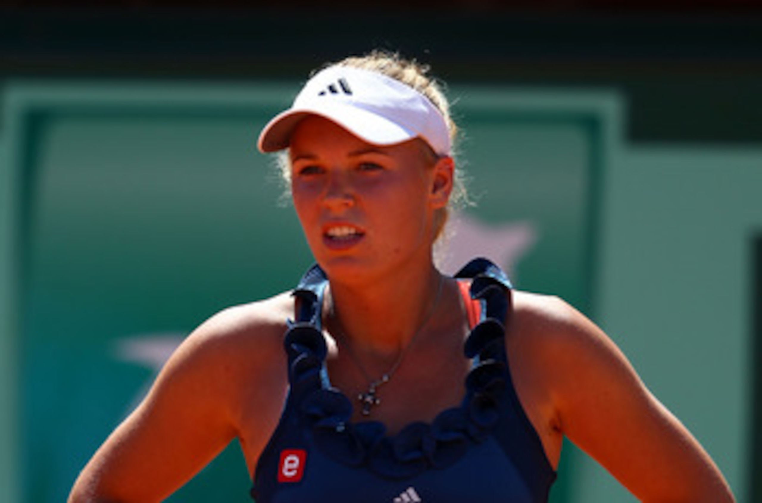 PARIS, FRANCE - MAY 25:  Caroline Wozniacki of Denmark looks on during the women's singles round two match between Caroline Wozniacki of Denmark and Aleksandra Wozniak of Canada on day four of the French Open at Roland Garros on May 25, 2011 in Paris, Fra