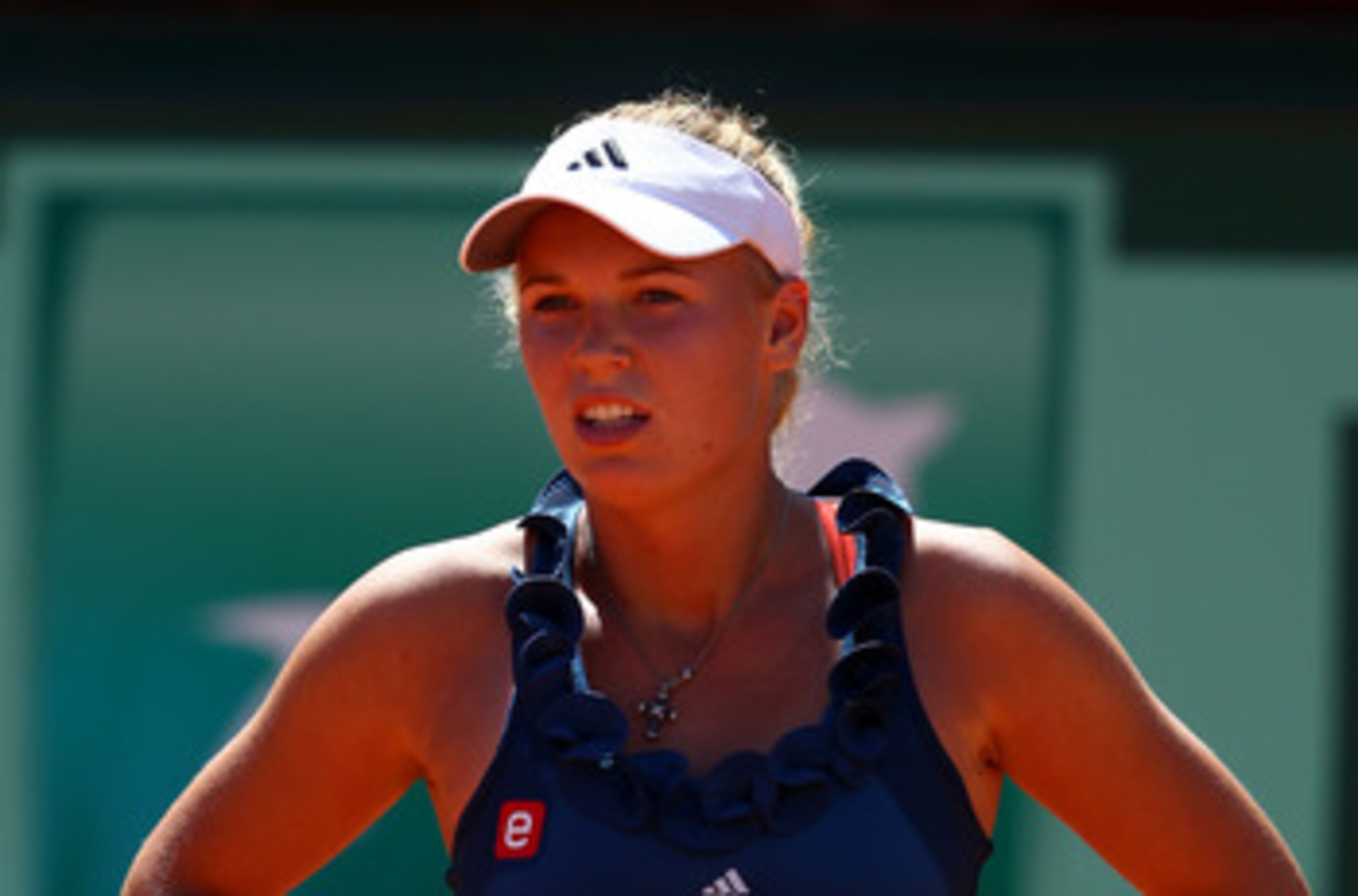 PARIS, FRANCE - MAY 25:  Caroline Wozniacki of Denmark looks on during the women's singles round two match between Caroline Wozniacki of Denmark and Aleksandra Wozniak of Canada on day four of the French Open at Roland Garros on May 25, 2011 in Paris, Fra