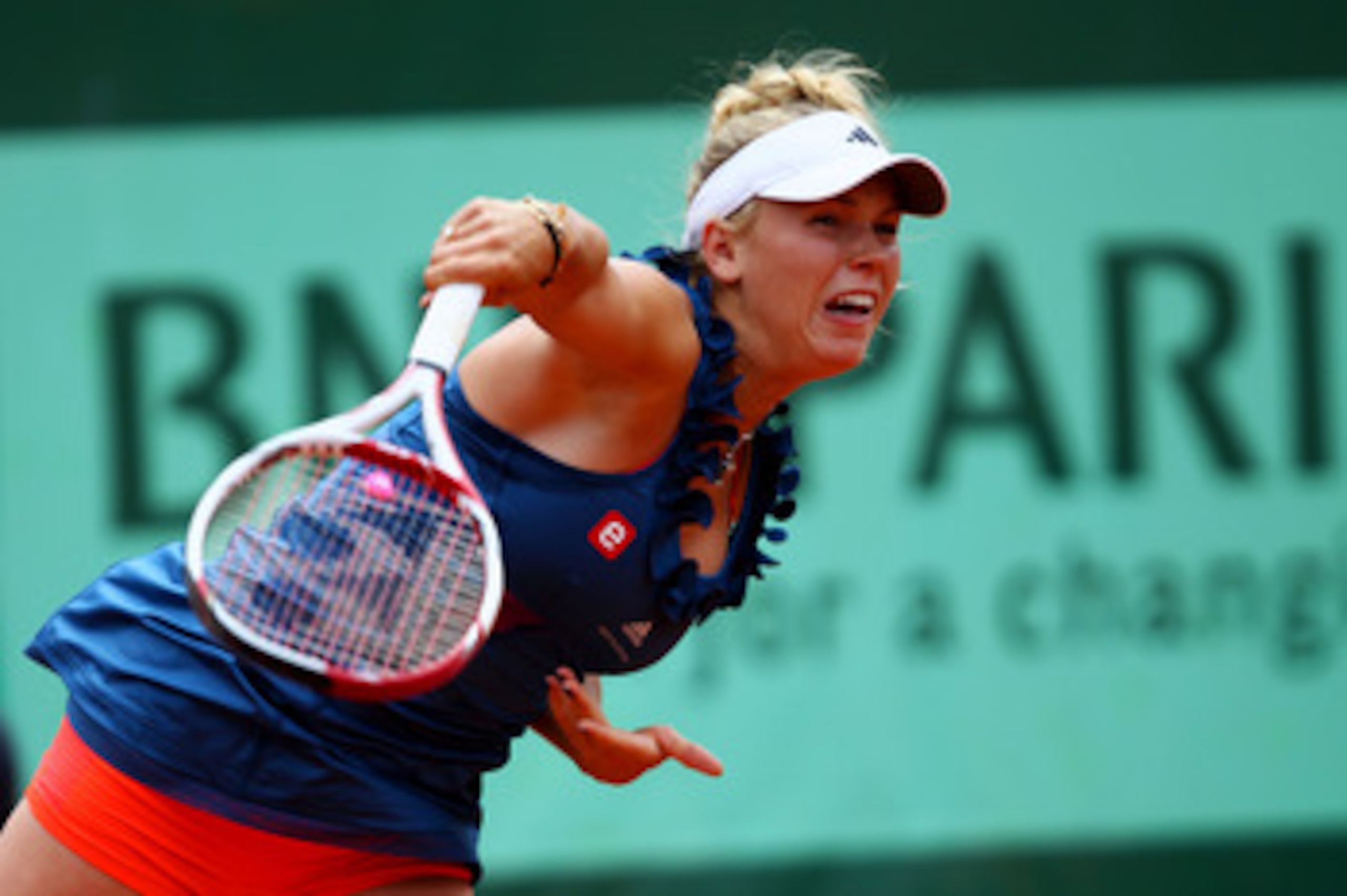 PARIS, FRANCE - MAY 27:  Caroline Wozniacki of Denmark serves during the women's singles round three match between Caroline Wozniacki of Denmark and Daniela Hantuchova of Slovakia on day six of the French Open at Roland Garros on May 27, 2011 in Paris, Fr