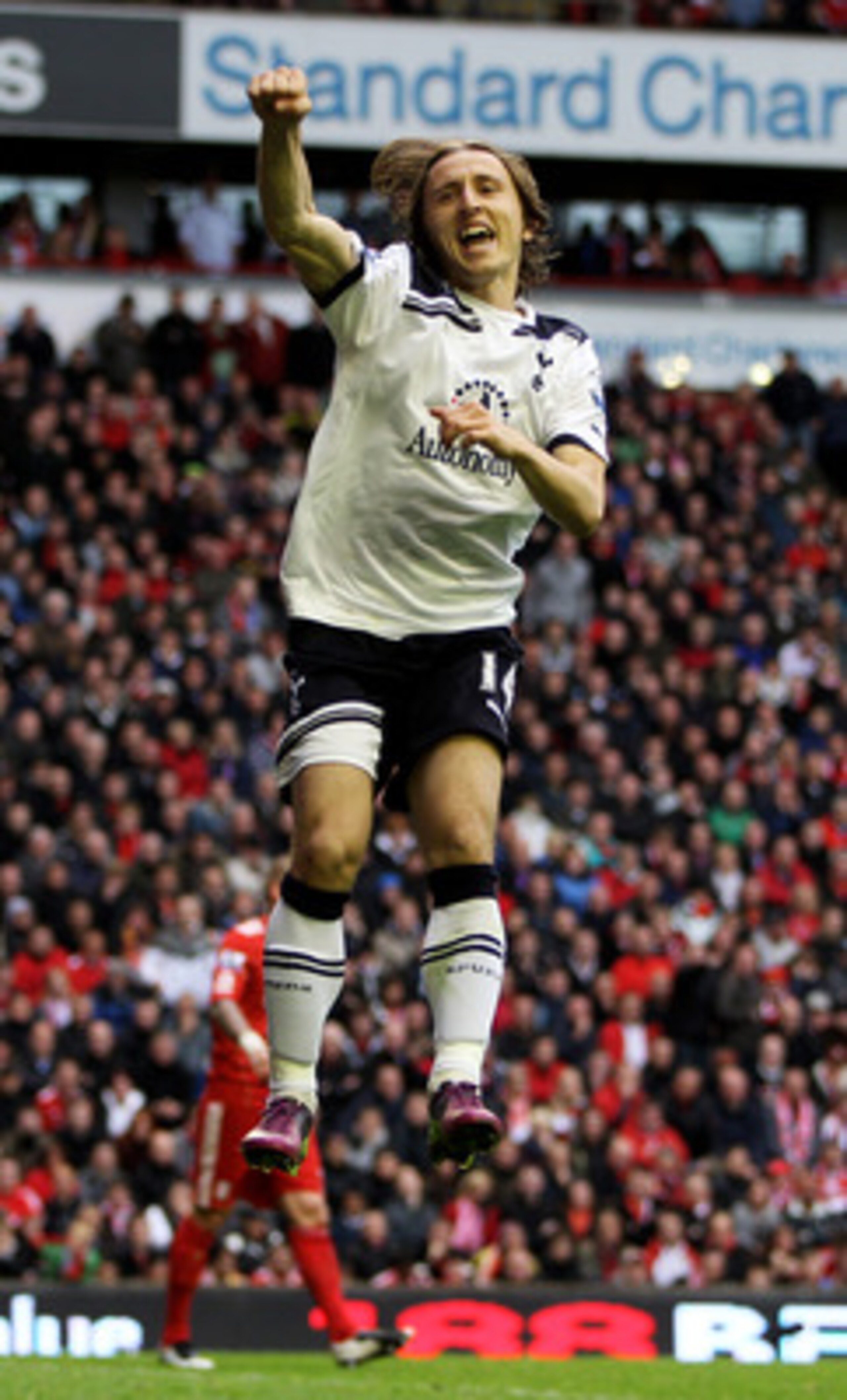 LIVERPOOL, ENGLAND - MAY 15:  Luka Modric of Spurs cedlebrates after scoring his team's second goal from the penalty spot during the Barclays Premier League match between Liverpool and Tottenham Hotspur at Anfield on May 15, 2011 in Liverpool, England.  (