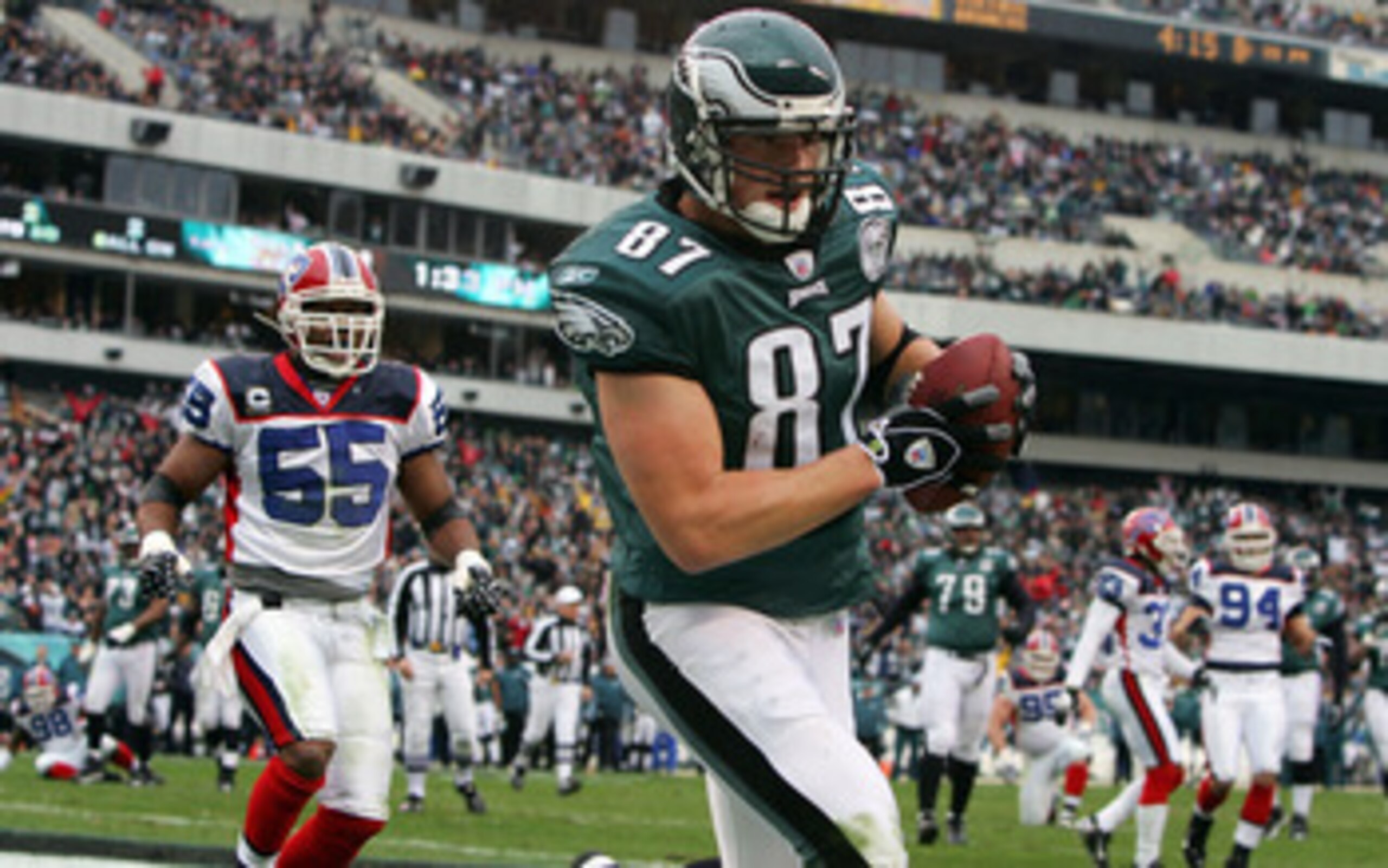 PHILADELPHIA - DECEMBER 30:  Brent Celek #87 of the Philadelphia Eagles catches a touchdown pass in the first quarter against Angelo Crowell #55 of the Buffalo Bills on December 30, 2007 at Lincoln Financial Field in Philadelphia, Pennsylvania.  (Photo by