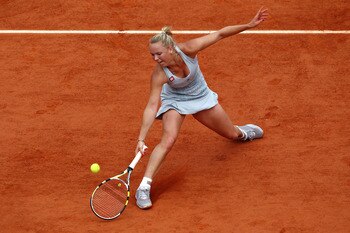 PARIS - MAY 30:  Caroline Wozniacki of Denmark plays a forehand volley during the women's singles fourth round match between Caroline Wozniacki of Denmark and Flavia Pennetta of Italy on day eight of the French Open at Roland Garros on May 30, 2010 in Par