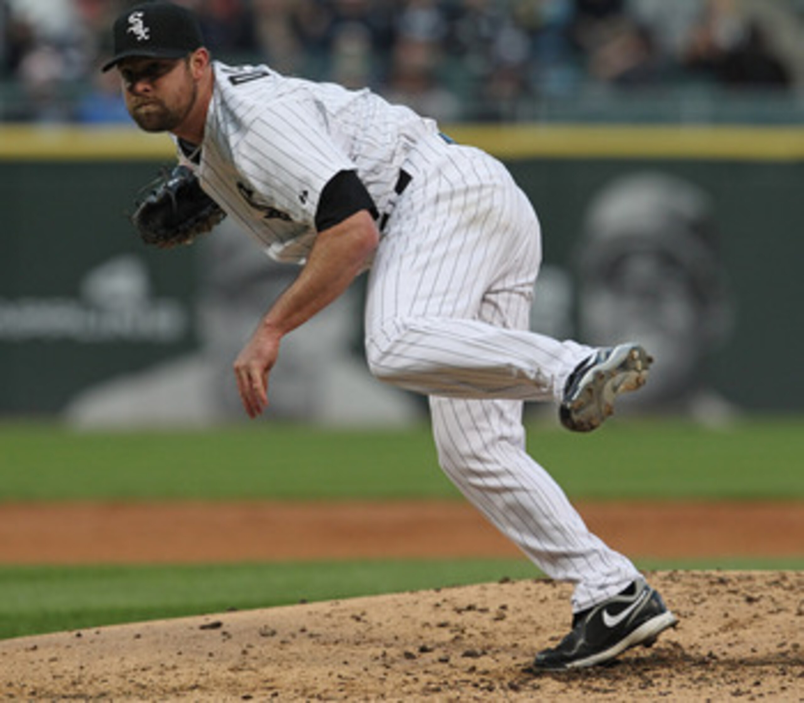 CHICAGO, IL - MAY 17: Starting pitcher John Danks #50 of the Chicago White Sox follows through after throwing a pitch against the Texas Rangers at U.S. Cellular Field on May 17, 2011 in Chicago, Illinois. (Photo by Jonathan Daniel/Getty Images) CHICAGO, IL - MAY 17: Starting pitcher John Danks #50 of the Chicago White Sox follows through after throwing a pitch against the Texas Rangers at U.S. Cellular Field on May 17, 2011 in Chicago, Illinois. (Photo by Jonathan Daniel/Getty Images)