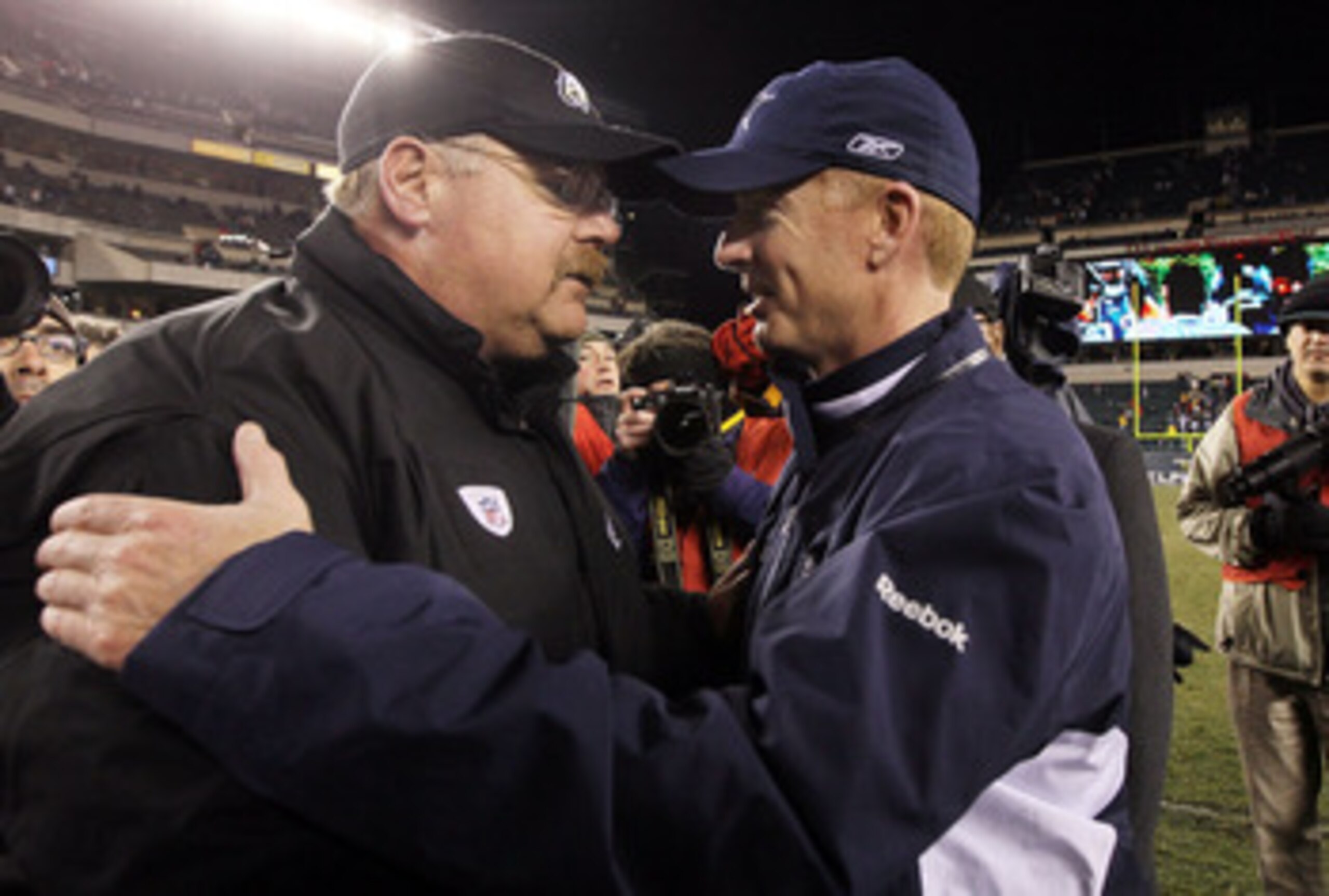 PHILADELPHIA, PA - JANUARY 02: Head coach Andy Reid of the Philadelphia Eagles meets with head coach Jason Garrett of the Dallas Cowboys after their game on January 2, 2011 at Lincoln Financial Field in Philadelphia, Pennsylvania. The Cowboys defeated the