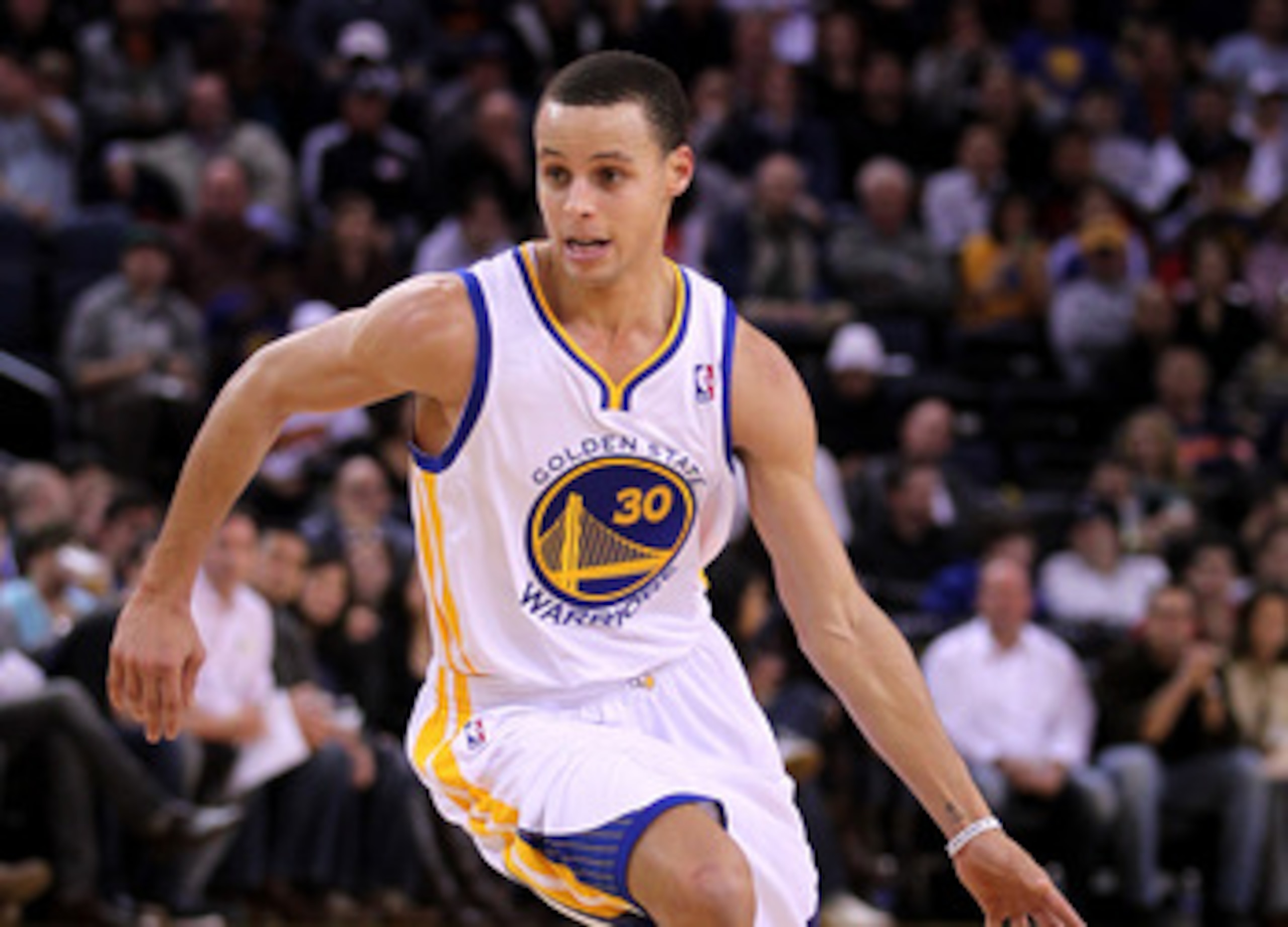 OAKLAND, CA - MARCH 25:  Stephen Curry #30 of the Golden State Warriors in action against the Toronto Raptors at Oracle Arena on March 25, 2011 in Oakland, California. NOTE TO USER: User expressly acknowledges and agrees that, by downloading and or using