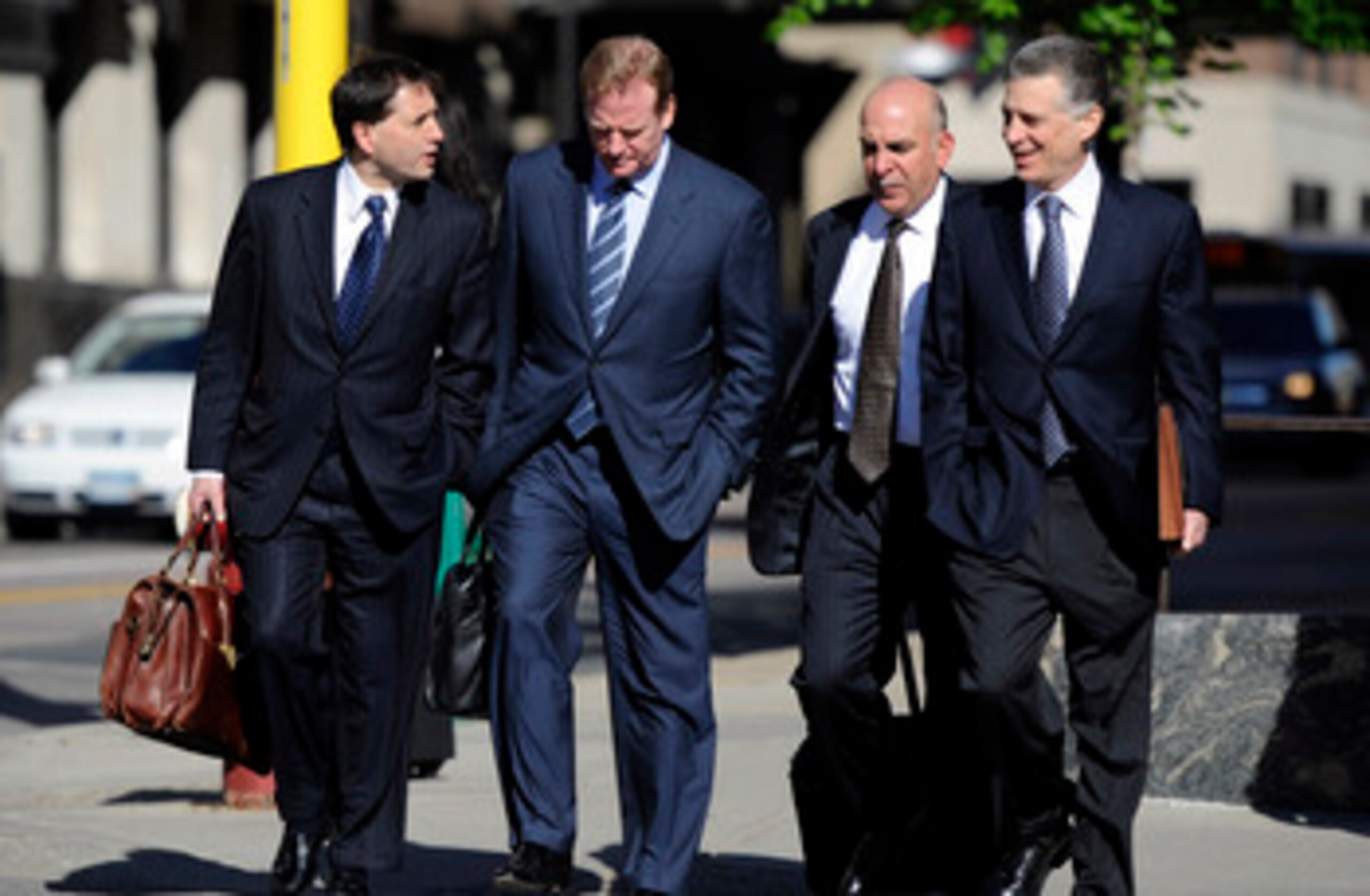 MINNEAPOLIS, MN - MAY 17: NFL lawyer Jeff Pash (L), NFL Commissioner Roger Goodell and Art Rooney II (R), president of the Pittsburgh Steelers arrive for court ordered mediation at the U.S. Courthouse on May 17, 2011 in Minneapolis, Minnesota. As the NFL