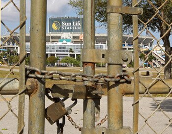 MIAMI GARDENS, FL - MARCH 03: A view of Sun Life Stadium behind a locked gate as the NFL lockout looms on March 3, 2011 in Miami Gardens, Florida. (Photo by Mike Ehrmann/Getty Images) MIAMI GARDENS, FL - MARCH 03: A view of Sun Life Stadium behind a locked gate as the NFL lockout looms on March 3, 2011 in Miami Gardens, Florida. (Photo by Mike Ehrmann/Getty Images)