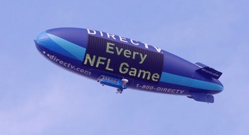 HOUSTON - NOVEMBER 28: The DIrecTV blimp flies over Reliant Stadium on November 28, 2010 in Houston, Texas. (Photo by Bob Levey/Getty Images) HOUSTON - NOVEMBER 28: The DIrecTV blimp flies over Reliant Stadium on November 28, 2010 in Houston, Texas. (Photo by Bob Levey/Getty Images)