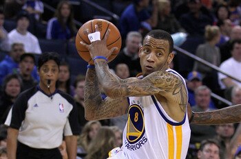 OAKLAND, CA - MARCH 25: Monta Ellis #8 of the Golden State Warriors drives to the basket against the Toronto Raptors at Oracle Arena on March 25, 2011 in Oakland, California. NOTE TO USER: User expressly acknowledges and agrees that, by downloading and or
