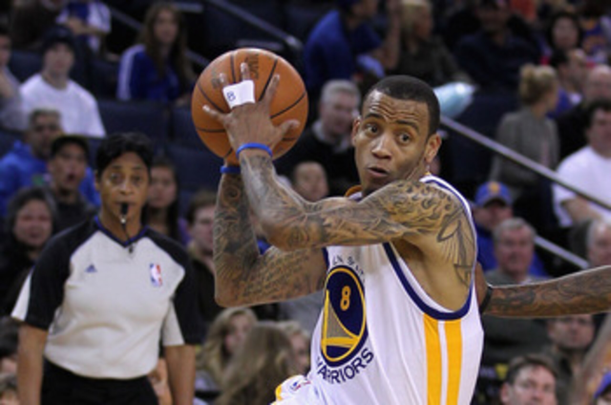 OAKLAND, CA - MARCH 25: Monta Ellis #8 of the Golden State Warriors drives to the basket against the Toronto Raptors at Oracle Arena on March 25, 2011 in Oakland, California. NOTE TO USER: User expressly acknowledges and agrees that, by downloading and or