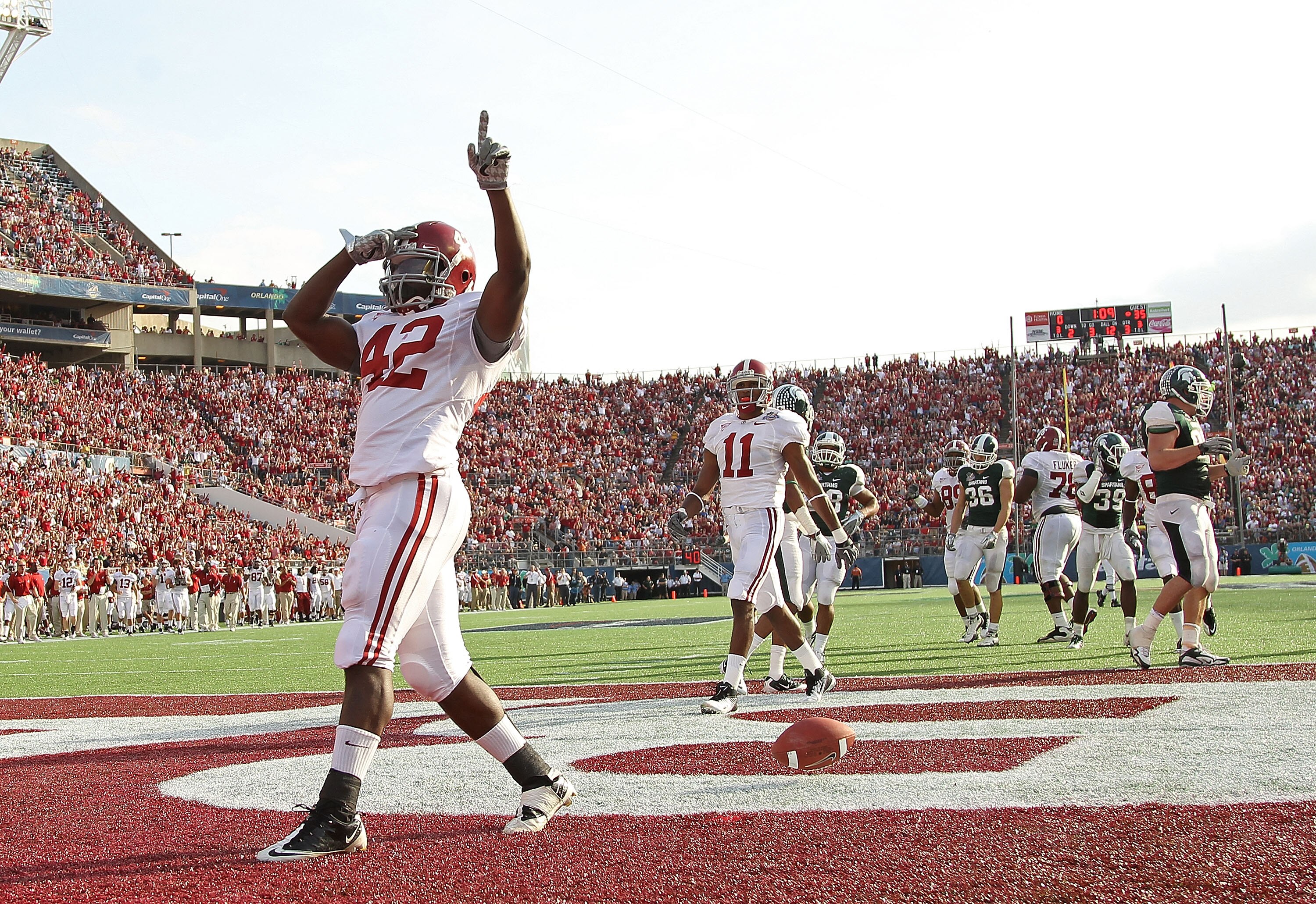 ORLANDO, FL - JANUARY 01: Eddie Lacy #42 of the Alabama Crimson Tide celebrates after rushing for a touchdown during the Capitol One Bowl against the Michigan State Spartans at the Florida Citrus Bowl on January 1, 2011 in Orlando, Florida. (Photo by Mi ORLANDO, FL - JANUARY 01: Eddie Lacy #42 of the Alabama Crimson Tide celebrates after rushing for a touchdown during the Capitol One Bowl against the Michigan State Spartans at the Florida Citrus Bowl on January 1, 2011 in Orlando, Florida. (Photo by Mi