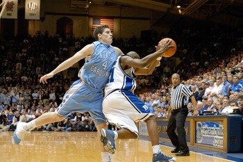 DURHAM, NC - FEBRUARY 07:  DeMarcus Nelson #21 of the Duke University Blue Devils battles Bobby Frasor #4 of the North Carolina Tar Heels for a rebound during their game on February 7, 2007 at Cameron Indoor Stadium in Durham, North Carolina.  (Photo by G