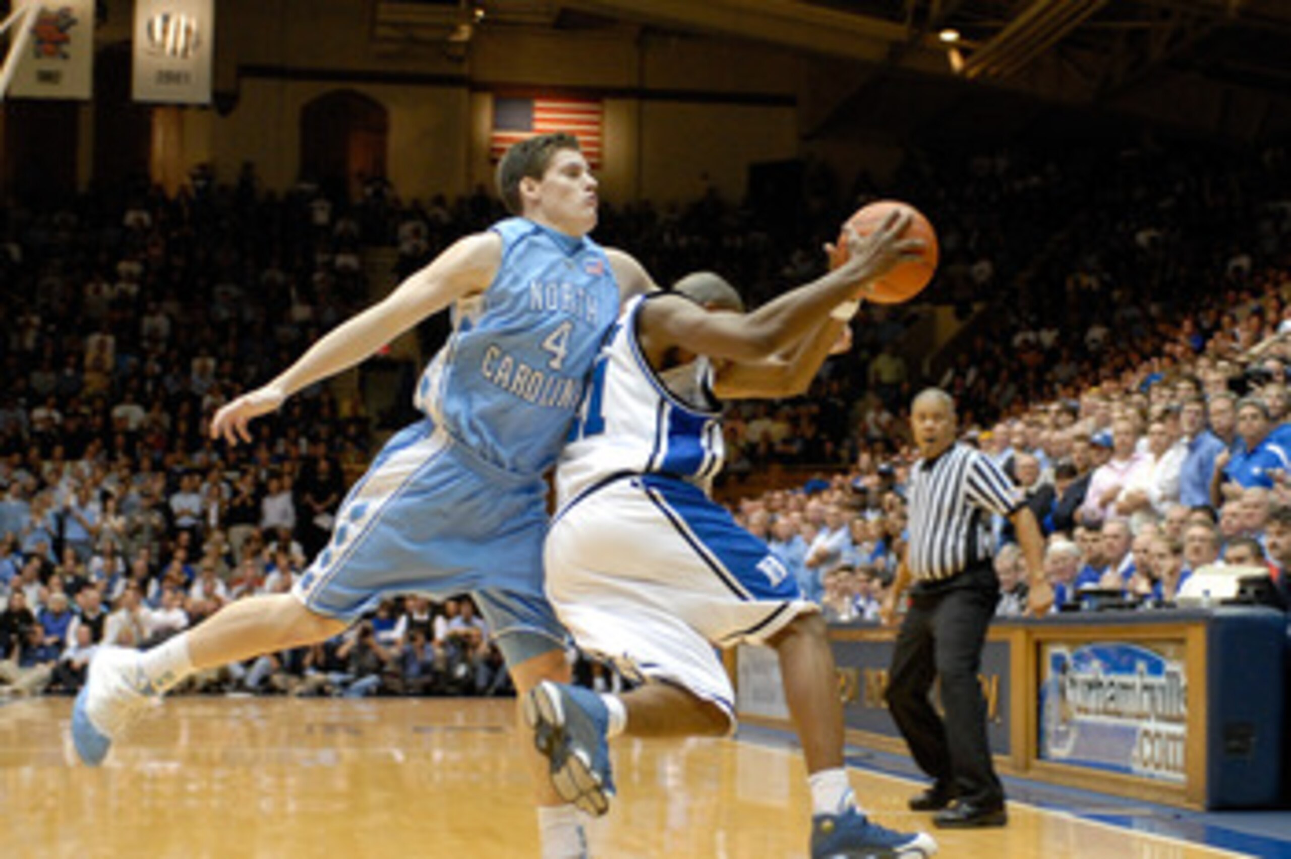 DURHAM, NC - FEBRUARY 07:  DeMarcus Nelson #21 of the Duke University Blue Devils battles Bobby Frasor #4 of the North Carolina Tar Heels for a rebound during their game on February 7, 2007 at Cameron Indoor Stadium in Durham, North Carolina.  (Photo by G