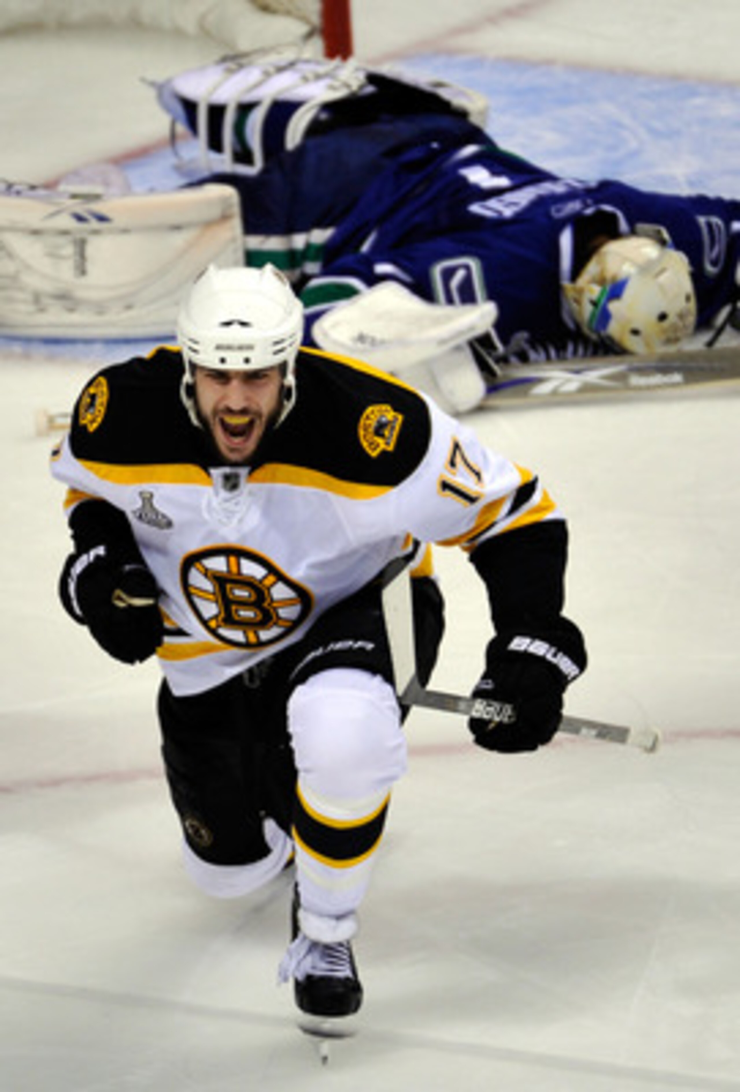 VANCOUVER, BC - JUNE 04:  Milan Lucic #17 of the Boston Bruins celebrates after scoring a goal against Roberto Luongo #1 of the Vancouver Canucks in the second period during Game Two of the 2011 NHL Stanley Cup Final at Rogers Arena on June 4, 2011 in Van