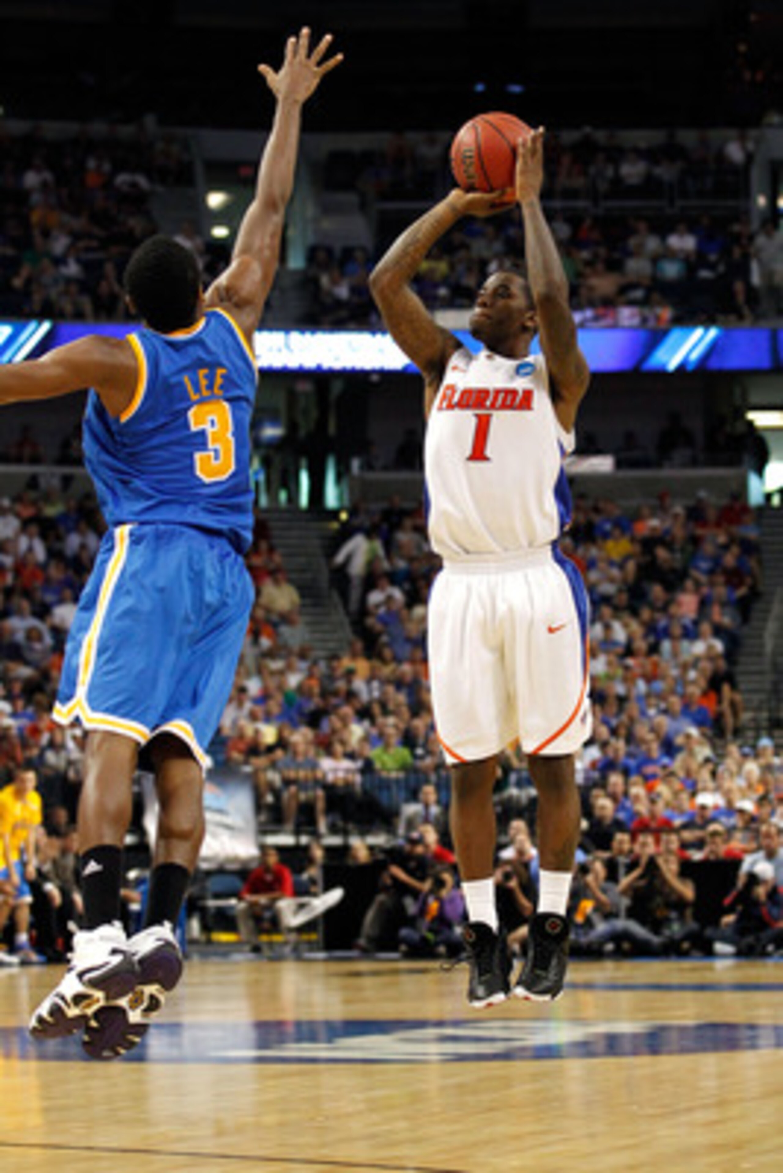 TAMPA, FL - MARCH 19:  Kenny Boynton #1 of the Florida Gators attempts a shot against Malcolm Lee #3 of the UCLA Bruins during the third round of the 2011 NCAA men's basketball tournament at St. Pete Times Forum on March 19, 2011 in Tampa, Florida. Florid