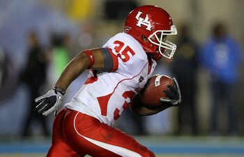 PASADENA, CA - SEPTEMBER 18:  Wide receiver Tyron Carrier  #35 of the Houston Cougars carries the ball against the UCLA Bruins at the Rose Bowl on September 18, 2010 in Pasadena, California.  UCLA won 31-13.  (Photo by Stephen Dunn/Getty Images)