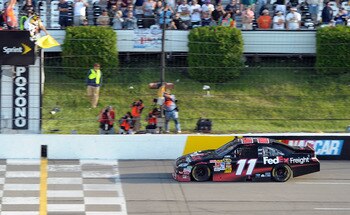 LONG POND, PA - JUNE 06:  Denny Hamlin, driver of the #11 FedEx Freight Toyota, celebrates in victory lane after winning the NASCAR Sprint Cup Series Gillette Fusion ProGlide 500 at Pocono Raceway on June 6, 2010 in Long Pond, Pennsylvania.  (Photo by Joh