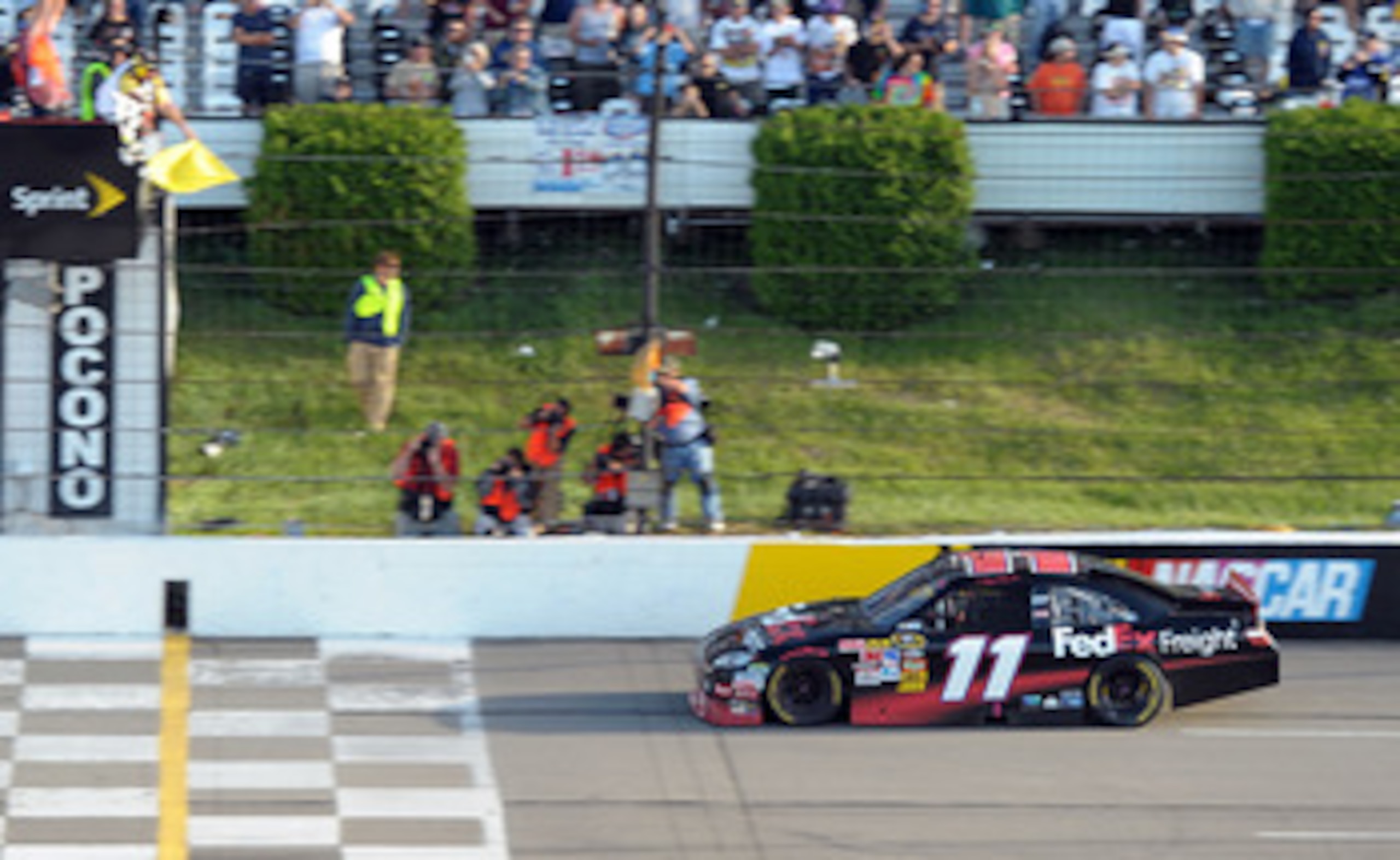LONG POND, PA - JUNE 06:  Denny Hamlin, driver of the #11 FedEx Freight Toyota, celebrates in victory lane after winning the NASCAR Sprint Cup Series Gillette Fusion ProGlide 500 at Pocono Raceway on June 6, 2010 in Long Pond, Pennsylvania.  (Photo by Joh