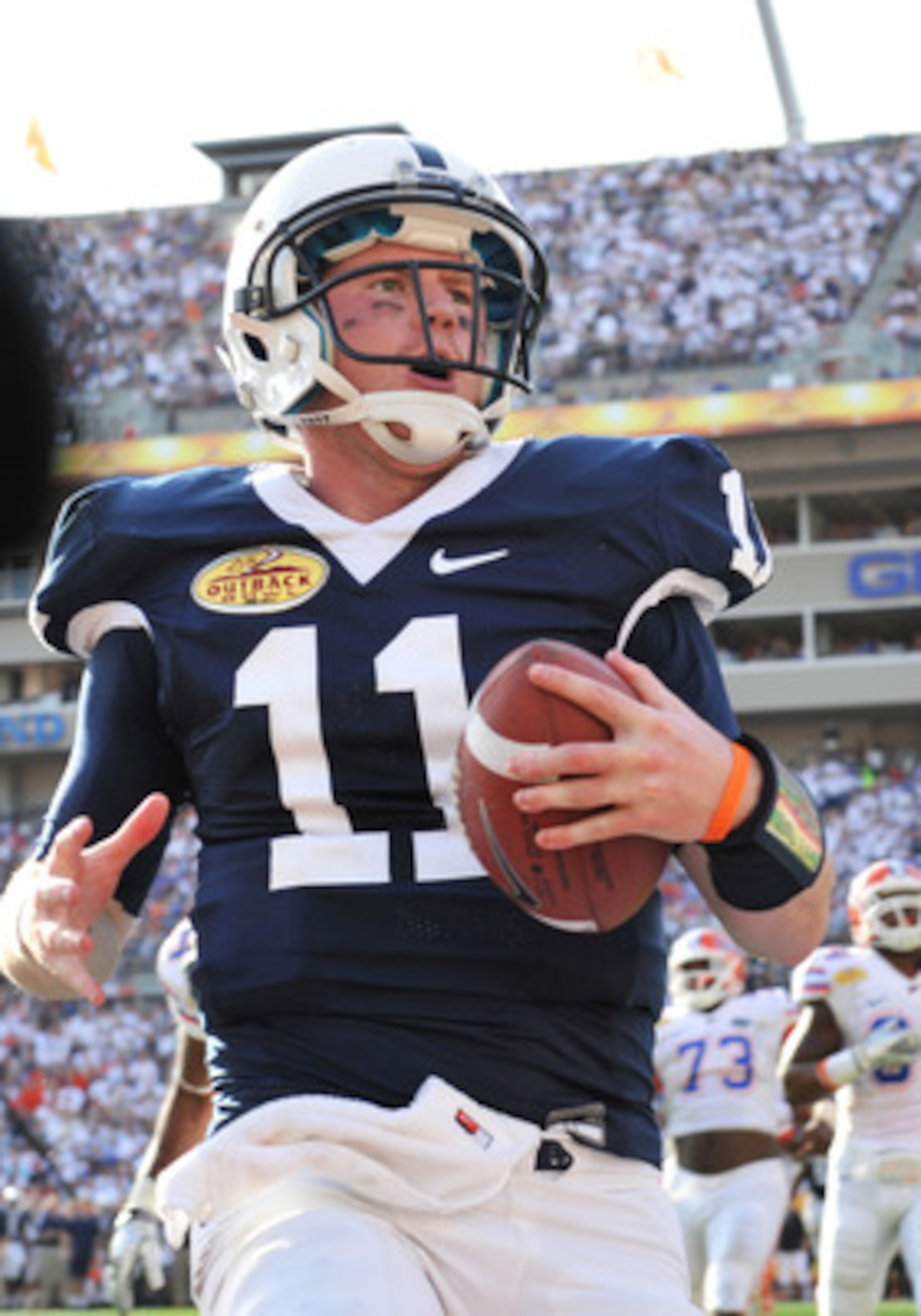 TAMPA, FL - JANUARY 1: Quarterback Matt McGloin #11 of the Penn State Nittany Lions runs for a touchdown against the Florida Gators January 1, 2011 in the 25th Outback Bowl at Raymond James Stadium in Tampa, Florida. (Photo by Al Messerschmidt/Getty Ima TAMPA, FL - JANUARY 1: Quarterback Matt McGloin #11 of the Penn State Nittany Lions runs for a touchdown against the Florida Gators January 1, 2011 in the 25th Outback Bowl at Raymond James Stadium in Tampa, Florida. (Photo by Al Messerschmidt/Getty Ima