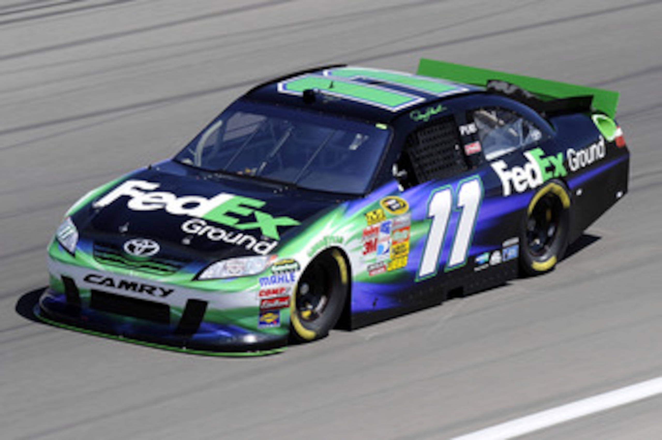 LAS VEGAS, NV - MARCH 04:  Denny Hamlin drives the #11 FedEx Ground Toyota during practice for the NASCAR Sprint Cup Series Kobalt Tools 400 at Las Vegas Motor Speedway on March 4, 2011 in Las Vegas, Nevada.  (Photo by John Harrelson/Getty Images for NASC