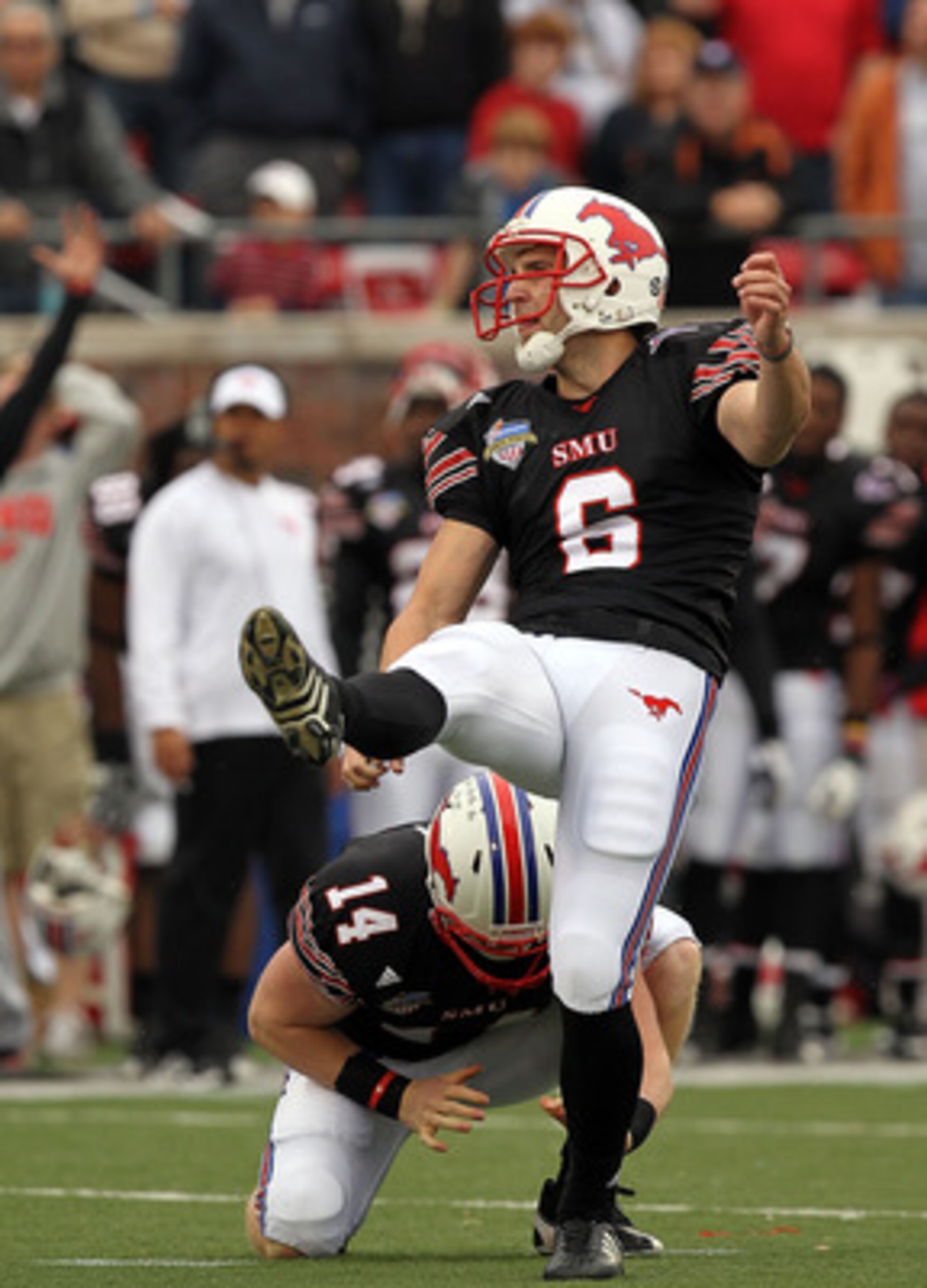 DALLAS, TX - DECEMBER 30:  Kicker Matt Szymanski #6 of the SMU Mustangs misses a field goal in the fourth quarter against the Army Black Knights during the Bell Helicopter Armed Forces Bowl at Gerald J. Ford Stadium on December 30, 2010 in Dallas, Texas. 