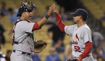 LOS ANGELES, CA - APRIL 16:  Catcher Gerald Laird #13 and closing pitcher Eduardo Sanchez #52 of the St Louis Cardinals celebrate their teams victory over the Los Angeles Dodgers at Dodger Stadium on April 16, 2011 in Los Angeles, California. The Cardinal