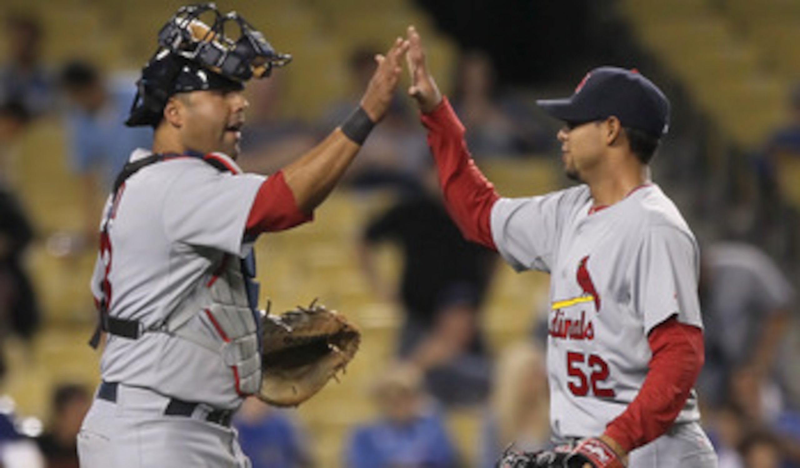 LOS ANGELES, CA - APRIL 16:  Catcher Gerald Laird #13 and closing pitcher Eduardo Sanchez #52 of the St Louis Cardinals celebrate their teams victory over the Los Angeles Dodgers at Dodger Stadium on April 16, 2011 in Los Angeles, California. The Cardinal