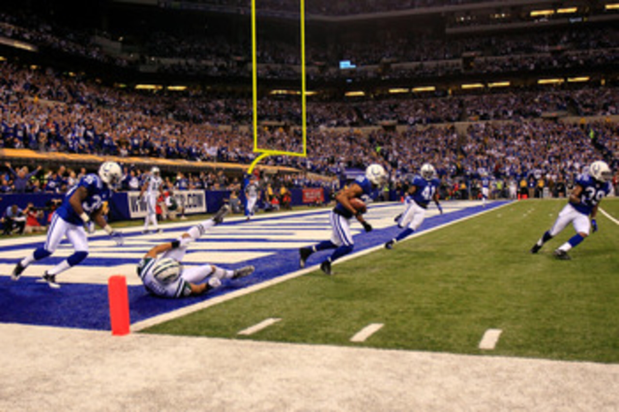 INDIANAPOLIS, IN - JANUARY 08: Justin Tryon #20 of the Indianapolis Colts returns an interception for positive yards on a pass intended for Dustin Keller #81 of the New York Jets during the second quarter of their 2011 AFC wild card playoff game at Lucas INDIANAPOLIS, IN - JANUARY 08: Justin Tryon #20 of the Indianapolis Colts returns an interception for positive yards on a pass intended for Dustin Keller #81 of the New York Jets during the second quarter of their 2011 AFC wild card playoff game at Lucas