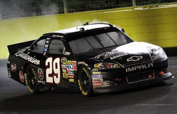 CONCORD, NC - MAY 29:  Kevin Harvick, driver of the #29 Budweiser Armed Forces Tribute Chevrolet, celebrates with a burnout after winning the NASCAR Sprint Cup Series Coca-Cola 600 at Charlotte Motor Speedway on May 29, 2011 in Concord, North Carolina.  (
