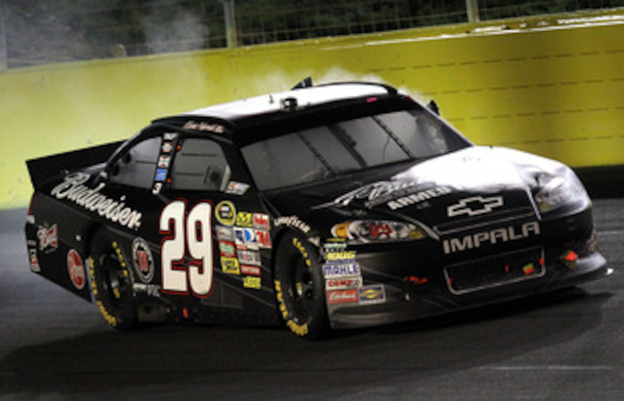 CONCORD, NC - MAY 29:  Kevin Harvick, driver of the #29 Budweiser Armed Forces Tribute Chevrolet, celebrates with a burnout after winning the NASCAR Sprint Cup Series Coca-Cola 600 at Charlotte Motor Speedway on May 29, 2011 in Concord, North Carolina.  (