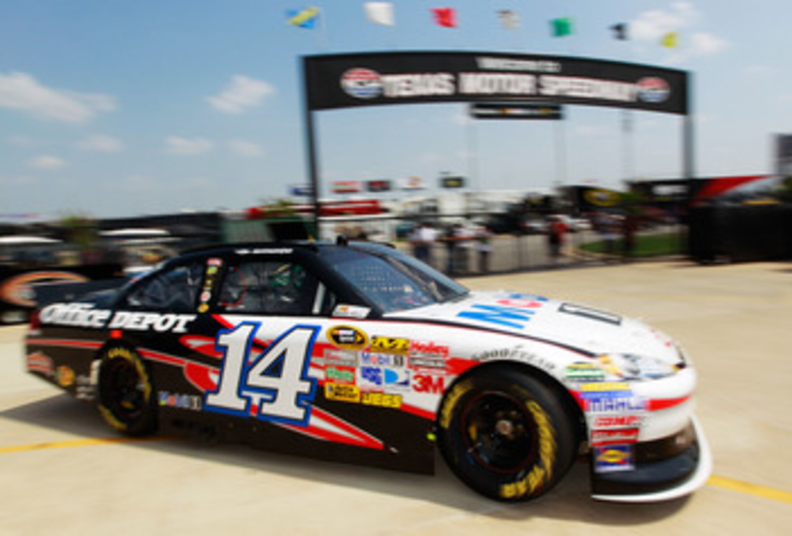 FORT WORTH, TX - APRIL 08:  Tony Stewart drives the #14 Mobil 1/Office Depot Chevrolet through the garage area during practice for the NASCAR Sprint Cup Series Samsung Mobile 500 at Texas Motor Speedway on April 8, 2011 in Fort Worth, Texas.  (Photo by To