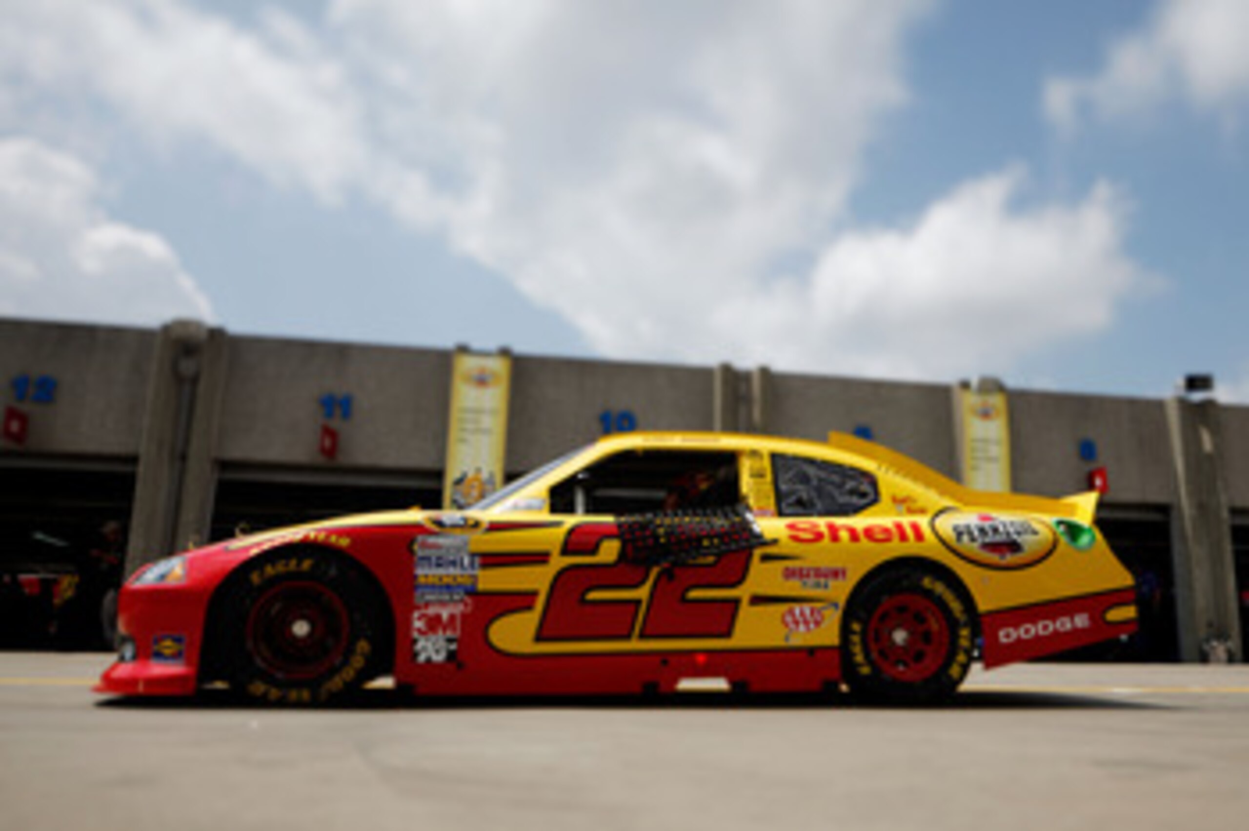 CHARLOTTE, NC - MAY 28:  (***EDITORS NOTE*** - THIS DIGITAL IMAGE WAS CREATED WITH THE USE OF VARIABLE FOCAL PLANE LENS) Kurt Busch drives the #22 Shell/Pennzoil Dodge through the garage area during practice for the NASCAR Sprint Cup Series Coca-Cola 600 