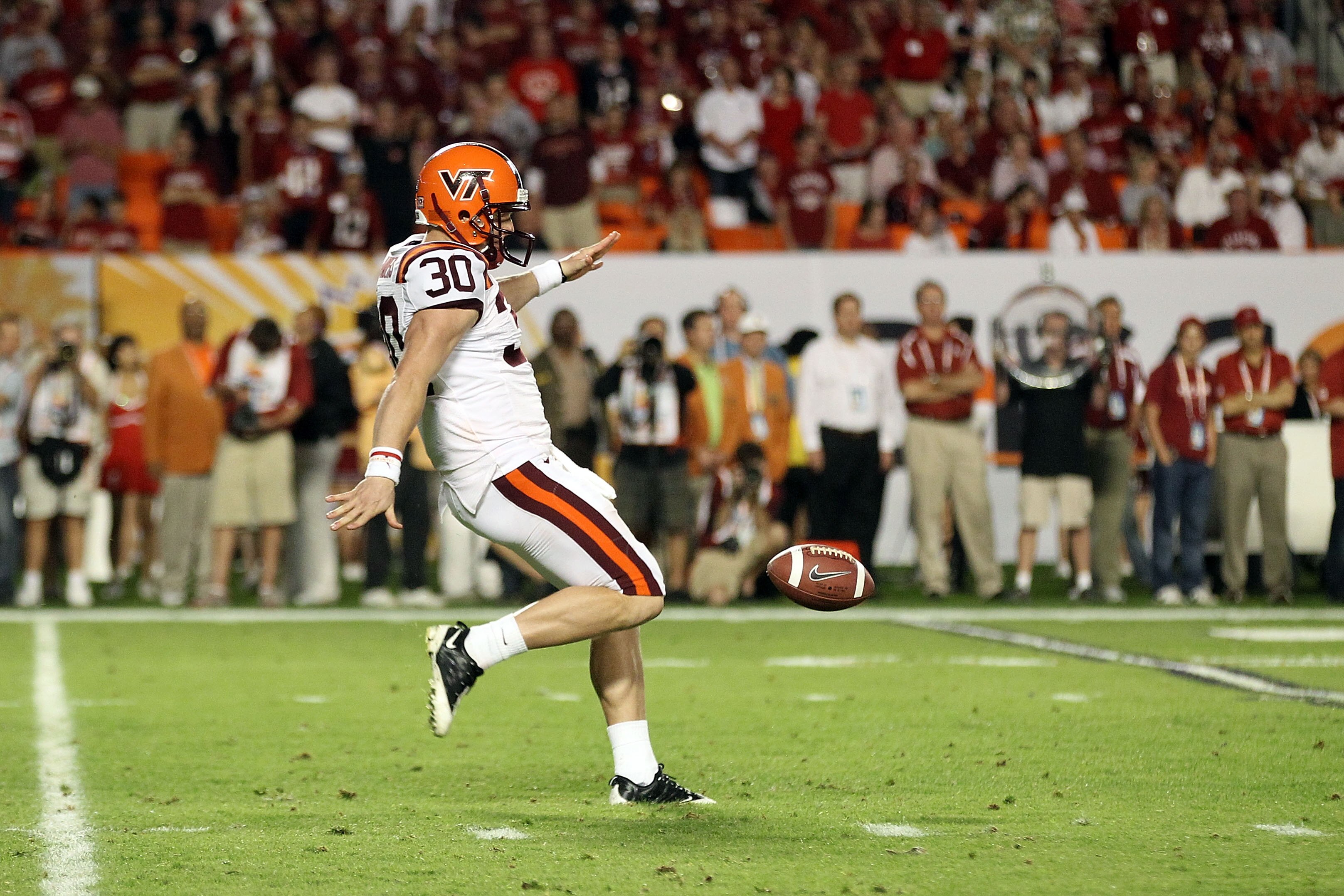 MIAMI, FL - JANUARY 03:  Brian Saunders #30 of the Virginia Tech Hokies punts the ball against the Stanford Cardinal during the 2011 Discover Orange Bowl at Sun Life Stadium on January 3, 2011 in Miami, Florida. Stanford won 40-12. (Photo by Streeter Leck