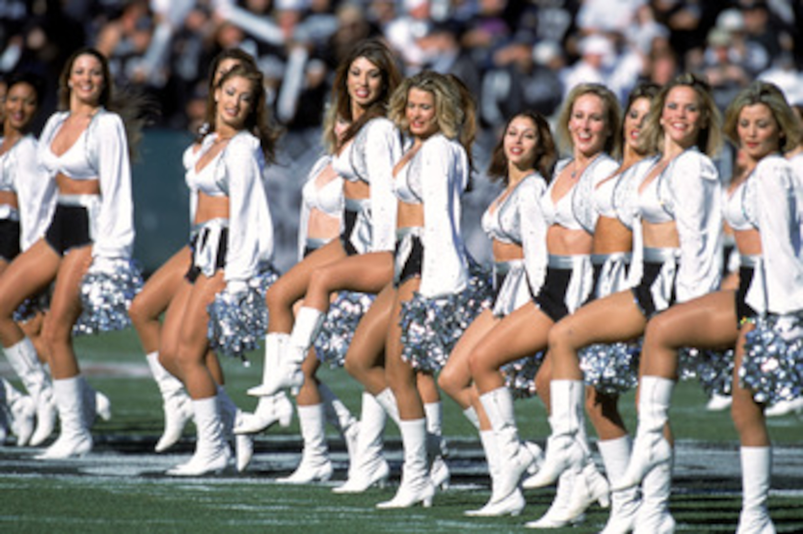 OAKLAND, CA - JANUARY 1:  The Raiderettes preform their routine during the game between the Baltimore Ravens and the Oakland Raiders at the Network Associates Coliseum in Oakland, California on January 14, 2001. The Ravens defeated the Raiders 16-3. (Phot