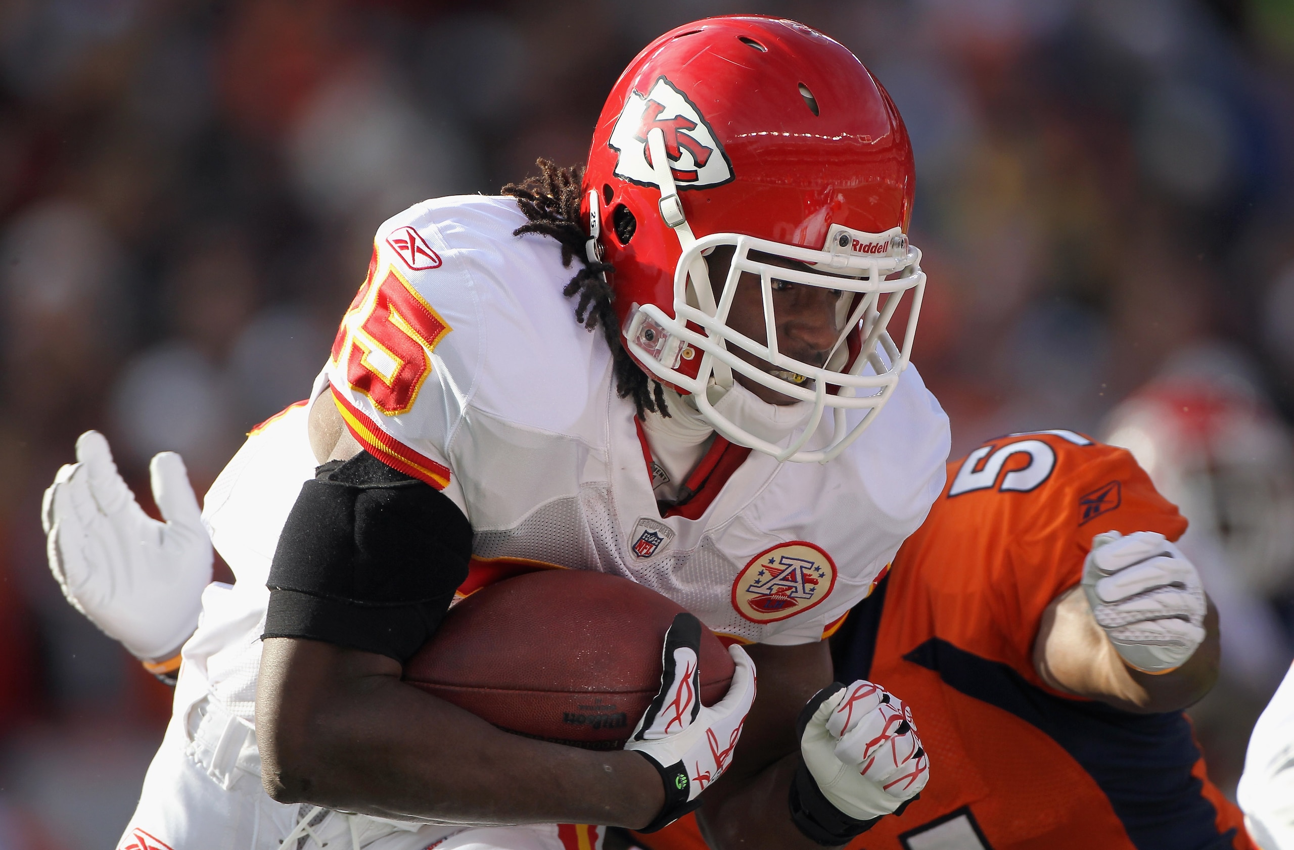 DENVER - NOVEMBER 14:  Running back Jamaal Charles #25 of the Kansas City Chiefs rushes the ball and is stopped by linebacker Joe Mays #51 of the Denver Bronco defense at INVESCO Field at Mile High on November 14, 2010 in Denver, Colorado.  (Photo by Doug
