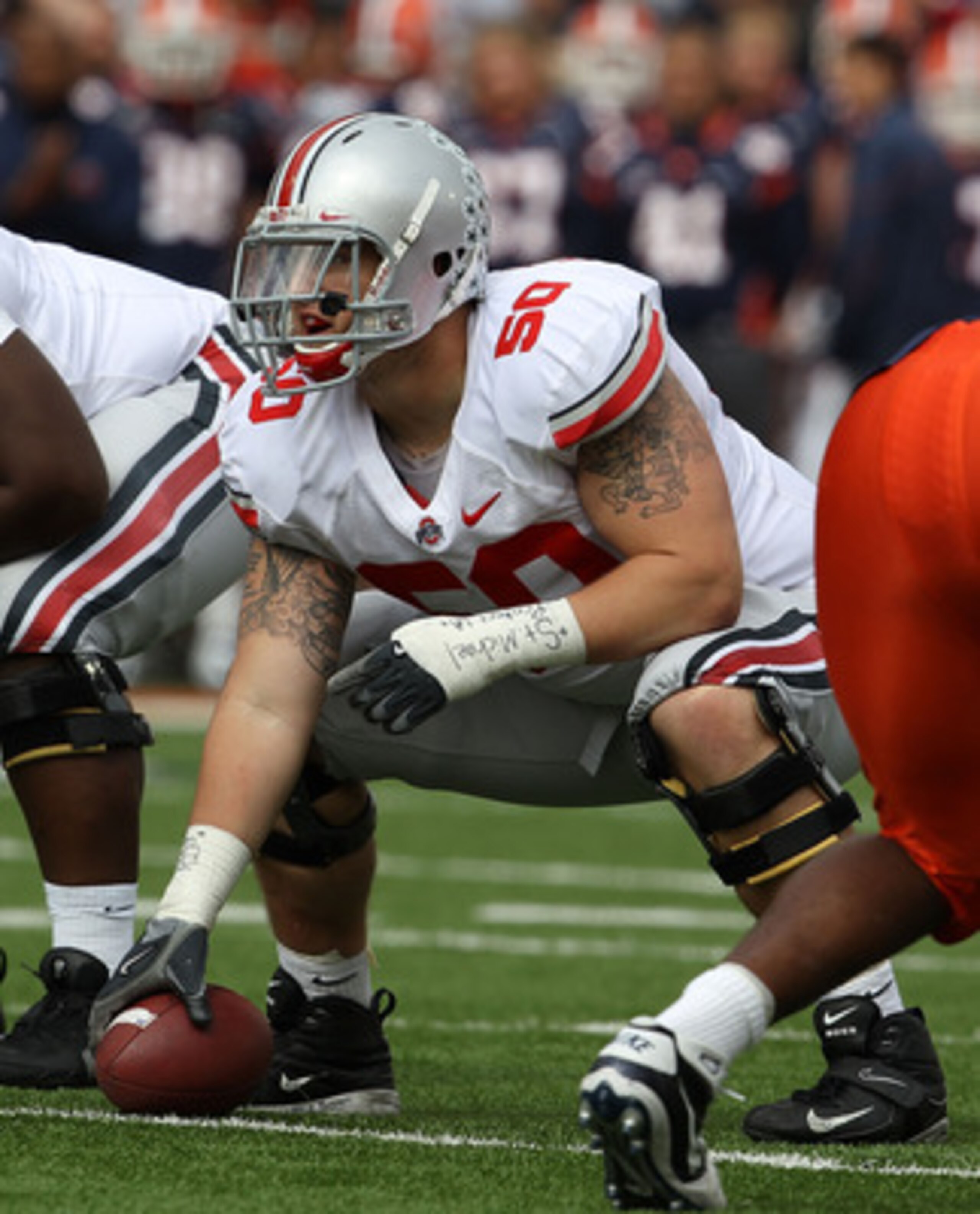 CHAMPAIGN, IL - OCTOBER 02: Mike Brewster #50 of the Ohio State Buckeyes waits to snap the ball against the Illinois Fighting Illini at Memorial Stadium on October 2, 2010 in Champaign, Illinois. Ohio State defeated Illinois 24-13. (Photo by Jonathan Dani