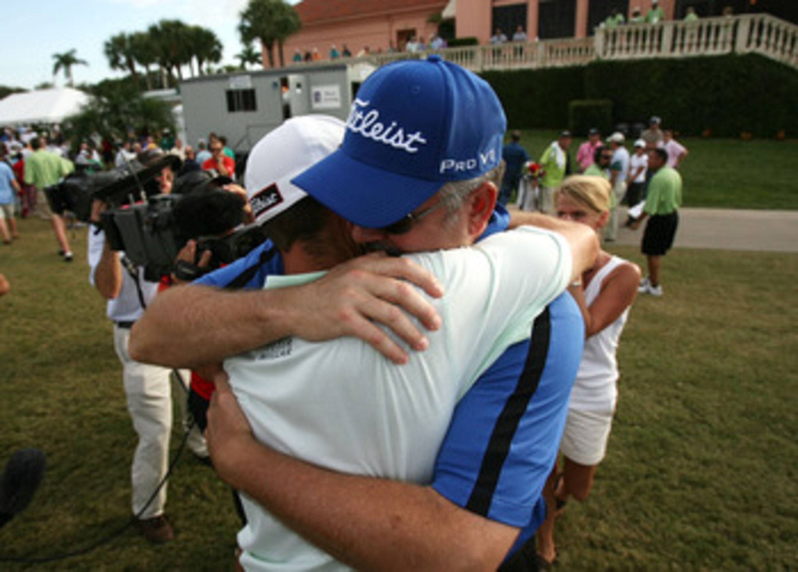 WEST PALM BEACH, FL - DECEMBER 07: Troy Merritt hugs his dad Mark Merritt after winning medalist honors during the final round of the 2009 PGA TOUR Qualifying Tournament at Bear Lakes Country Club on December 7, 2009 in West Palm Beach, Florida. (Photo WEST PALM BEACH, FL - DECEMBER 07: Troy Merritt hugs his dad Mark Merritt after winning medalist honors during the final round of the 2009 PGA TOUR Qualifying Tournament at Bear Lakes Country Club on December 7, 2009 in West Palm Beach, Florida. (Photo