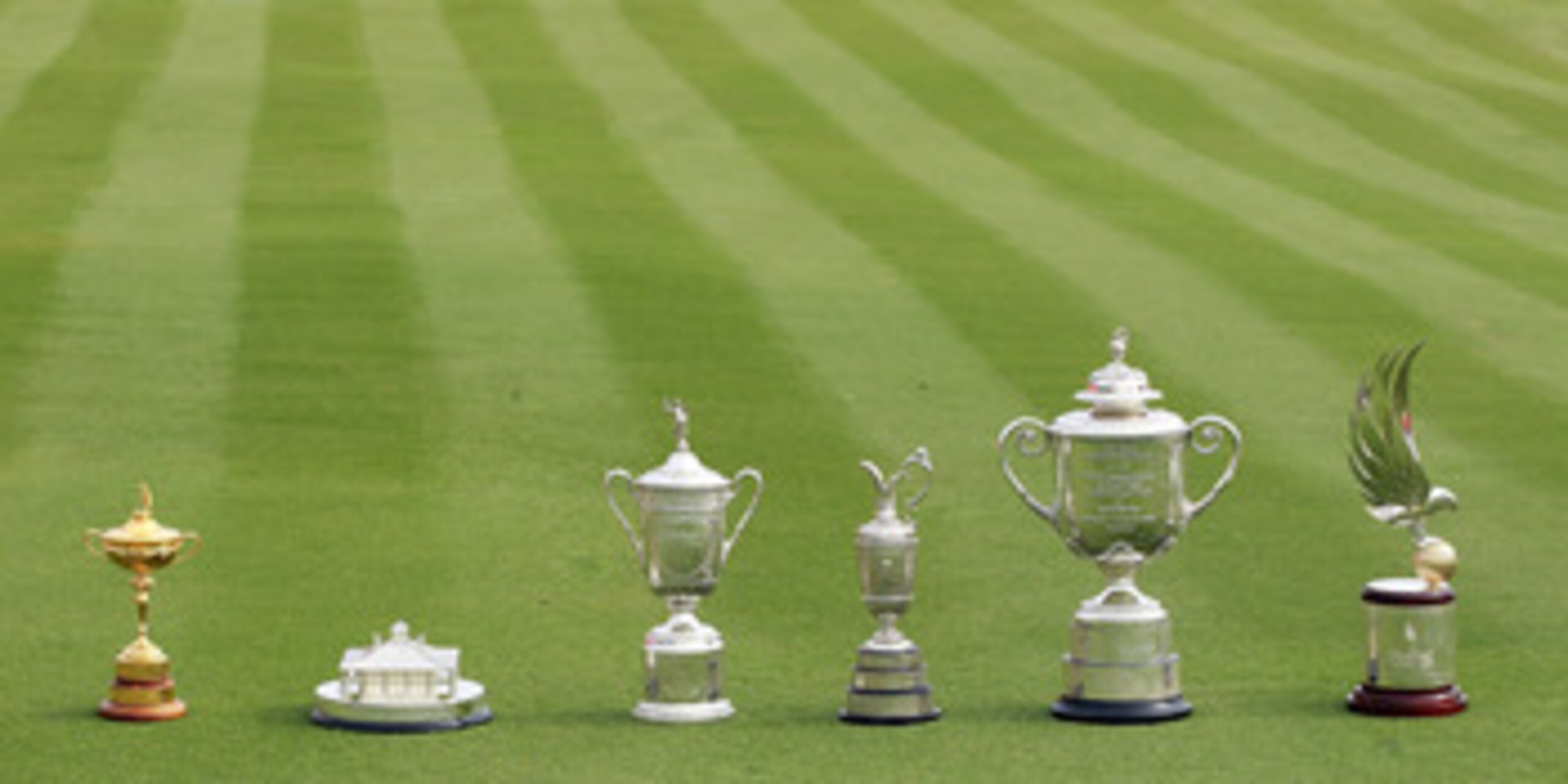 ABU DHABI, UNITED ARAB EMIRATES - JANUARY 23: A unique collection of golf trophies (l-r) The Ryder Cup won by Europe in 2010, The Masters player replica trophy won by Phil Mickelson of the USA in 2010, The US Open trophy won by Graeme McDowell of Norther ABU DHABI, UNITED ARAB EMIRATES - JANUARY 23: A unique collection of golf trophies (l-r) The Ryder Cup won by Europe in 2010, The Masters player replica trophy won by Phil Mickelson of the USA in 2010, The US Open trophy won by Graeme McDowell of Norther