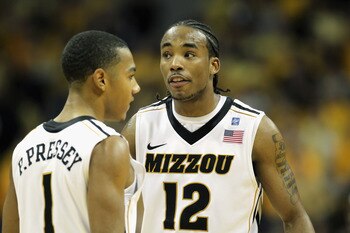COLUMBIA, MO - JANUARY 17:  Marcus Denmon #12 of the Missouri Tigers talks with Phil Pressey #1 during a timeout in the game against the Kansas State Wildcats on January 17, 2011 at Mizzou Arena in Columbia, Missouri.  (Photo by Jamie Squire/Getty Images)