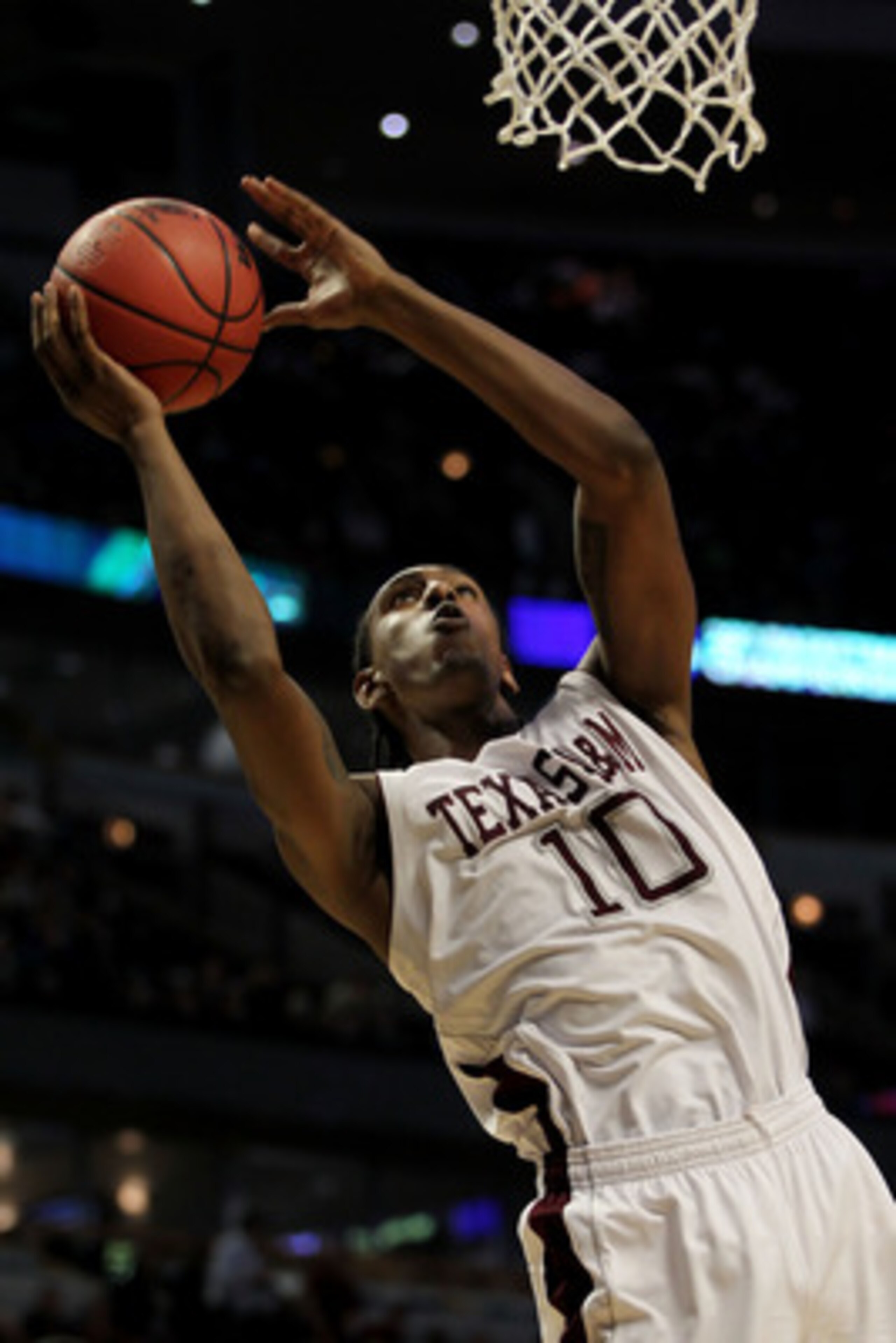 CHICAGO, IL - MARCH 18:  David Loubeau #10 of the Texas A&M Aggies shoots against the Florida State Seminoles in the second half during the second round of the 2011 NCAA men's basketball tournament at the United Center on March 18, 2011 in Chicago, Illino