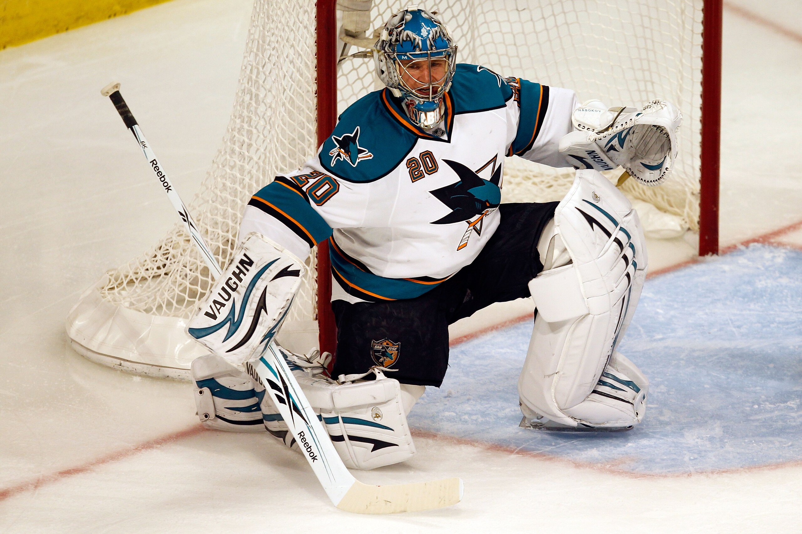 CHICAGO - MAY 23: Goaltender Evgeni Nabokov #20 of the San Jose Sharks looks on while taking on the Chicago Blackhawks in Game Four of the Western Conference Finals during the 2010 NHL Stanley Cup Playoffs at the United Center on May 23, 2010 in Chicago, CHICAGO - MAY 23: Goaltender Evgeni Nabokov #20 of the San Jose Sharks looks on while taking on the Chicago Blackhawks in Game Four of the Western Conference Finals during the 2010 NHL Stanley Cup Playoffs at the United Center on May 23, 2010 in Chicago,
