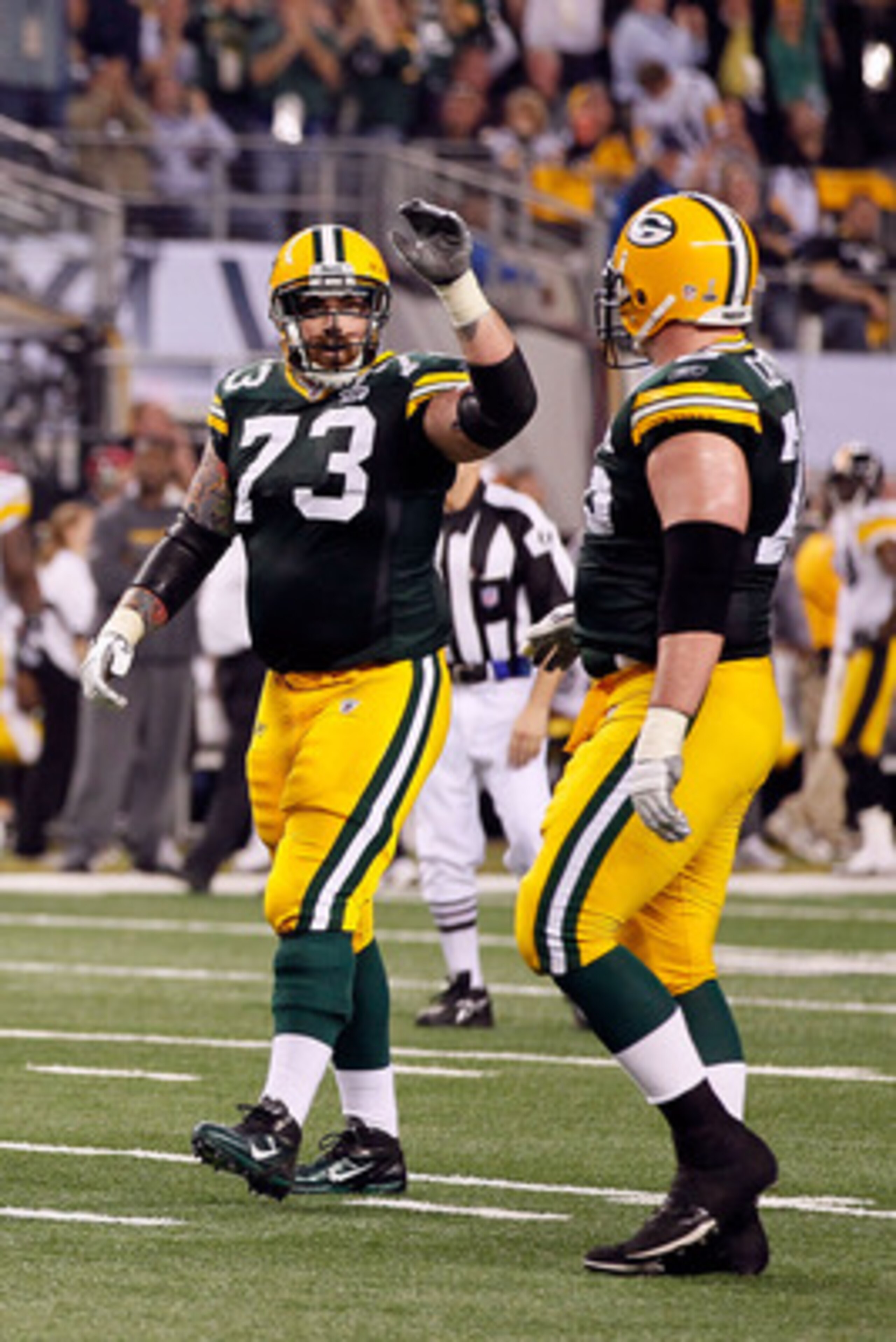 ARLINGTON, TX - FEBRUARY 06:  Daryn Colledge #73 of the Green Bay Packers reacts against the Pittsburgh Steelers during Super Bowl XLV at Cowboys Stadium on February 6, 2011 in Arlington, Texas.  (Photo by Kevin C. Cox/Getty Images)