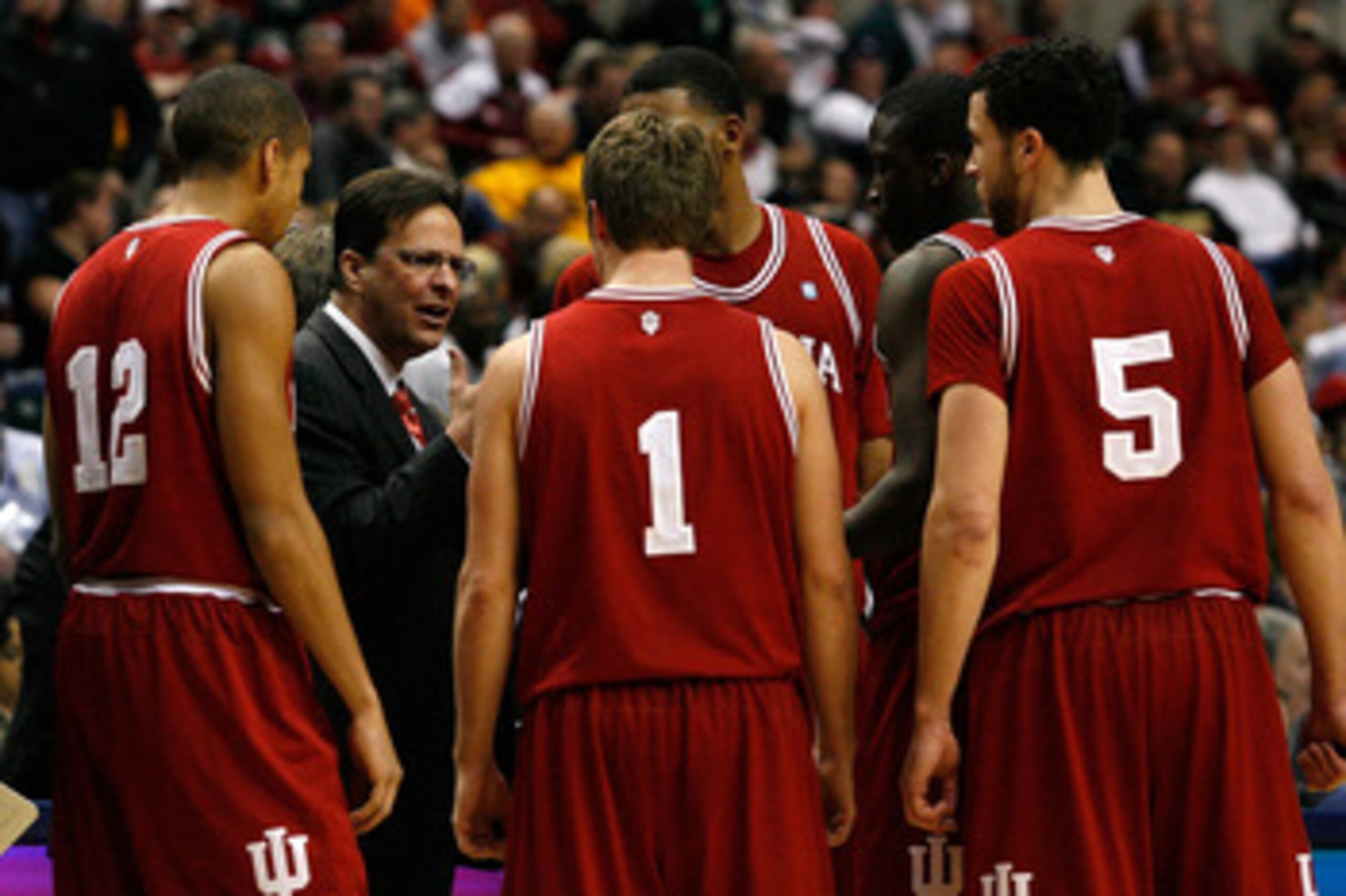 INDIANAPOLIS, IN - MARCH 10:  Head coach Tom Crean of the Indiana Hoosiers talks with his players during a timeout against the Penn State Nittany Lions during the first round of the 2011 Big Ten Men's Basketball Tournament at Conseco Fieldhouse on March 1