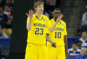 CHARLOTTE, NC - MARCH 20:  Evan Smotrycz #23 and Tim Hardaway Jr. #10 of the Michigan Wolverines react while taking on the Duke Blue Devils during the third round of the 2011 NCAA men's basketball tournament at Time Warner Cable Arena on March 20, 2011 in